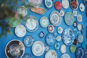 Decorative ceramic plates on blue wall