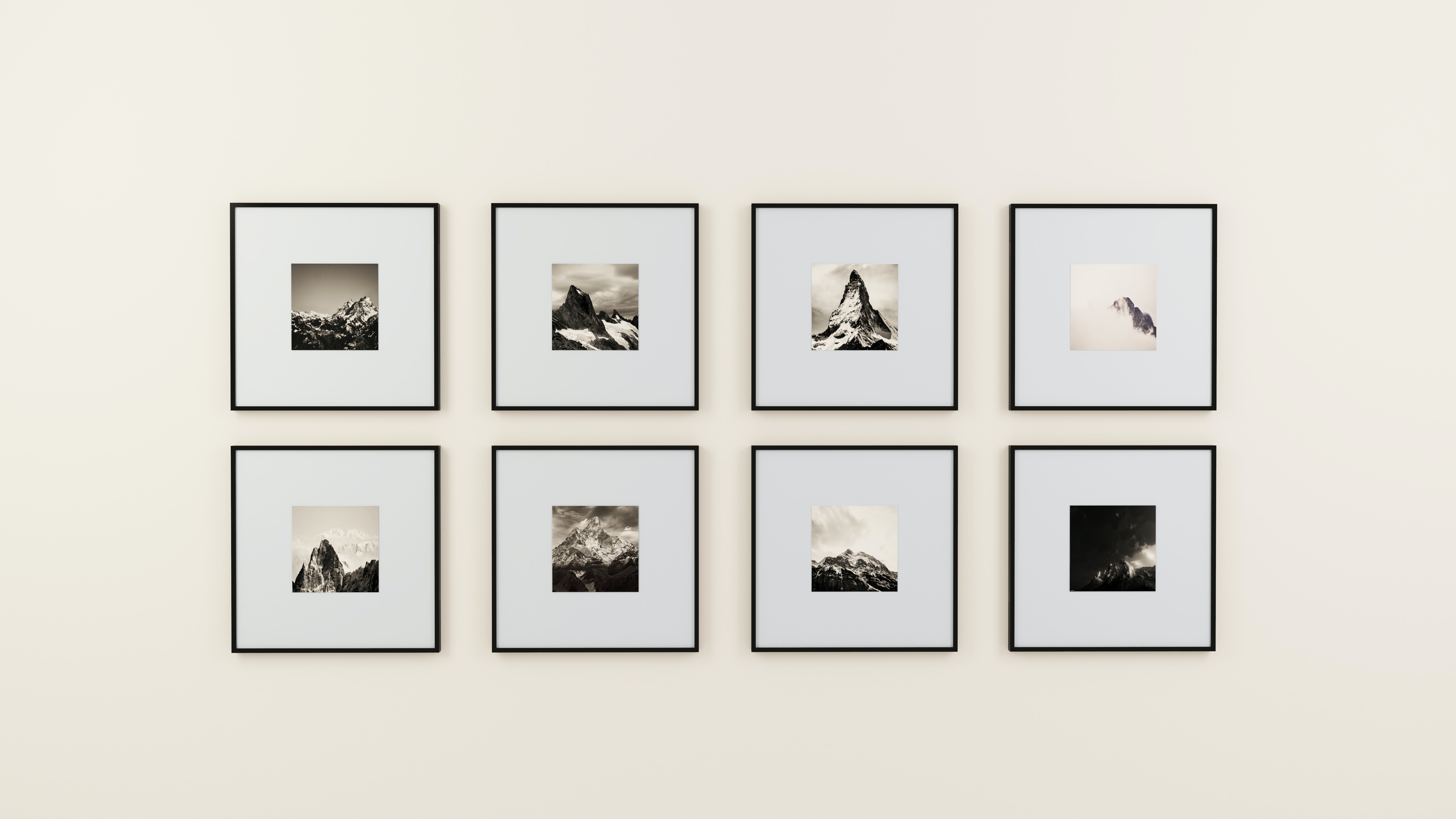 A gallery wall with multiple hanging photographs