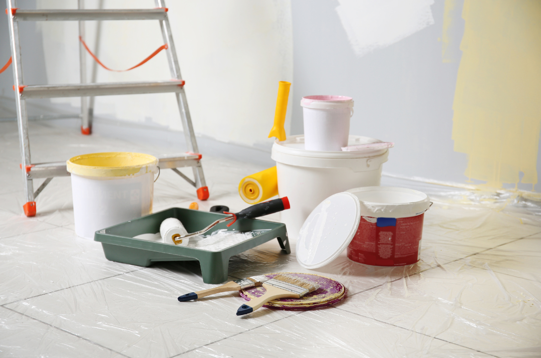 painting tools on floor and ladder