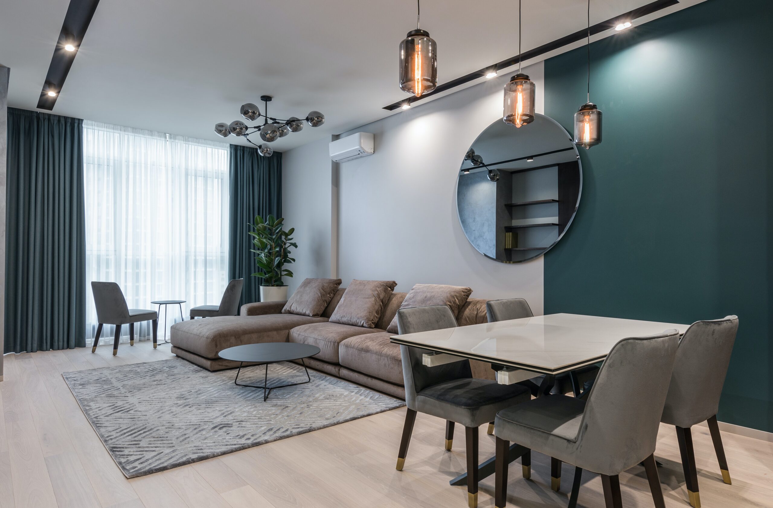 Modern dining room with green accent wall
