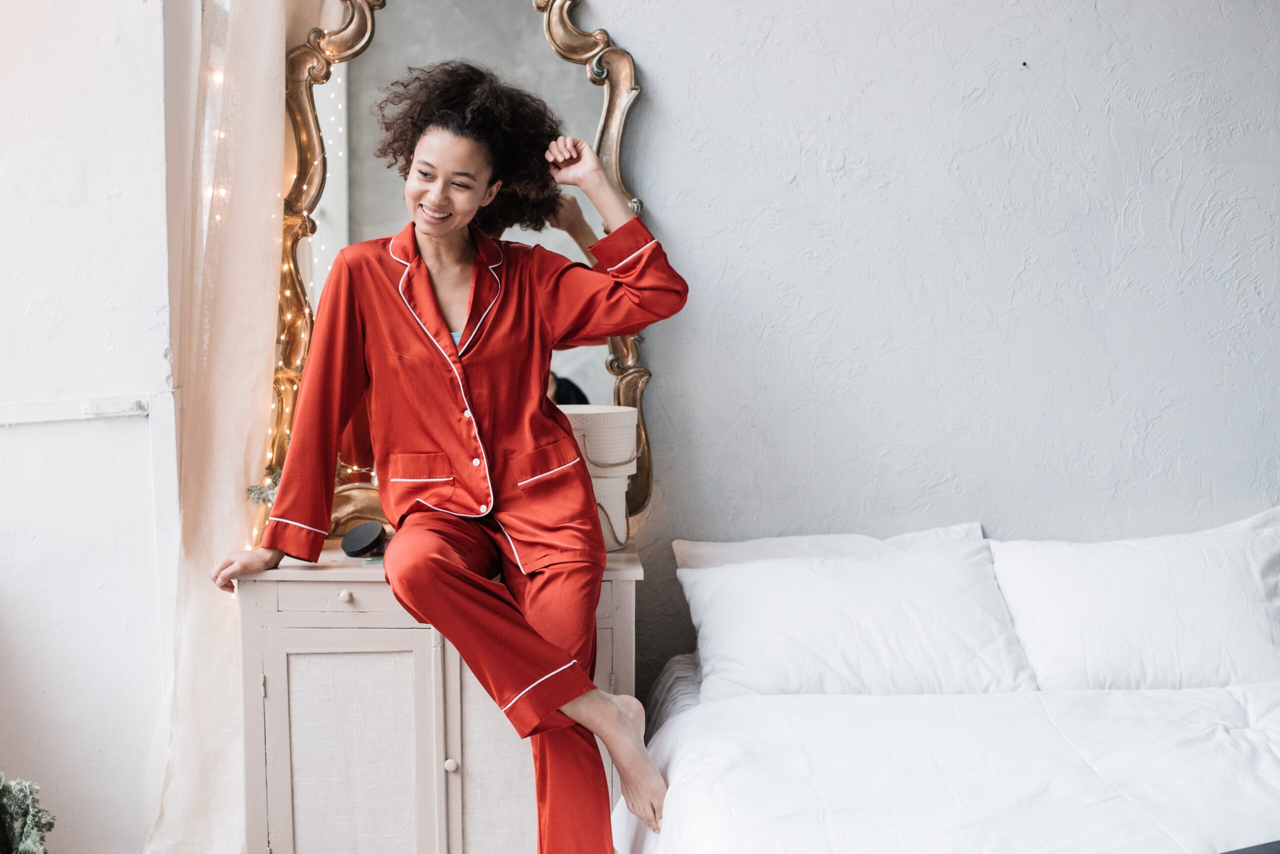 woman in red pajamas in bedroom