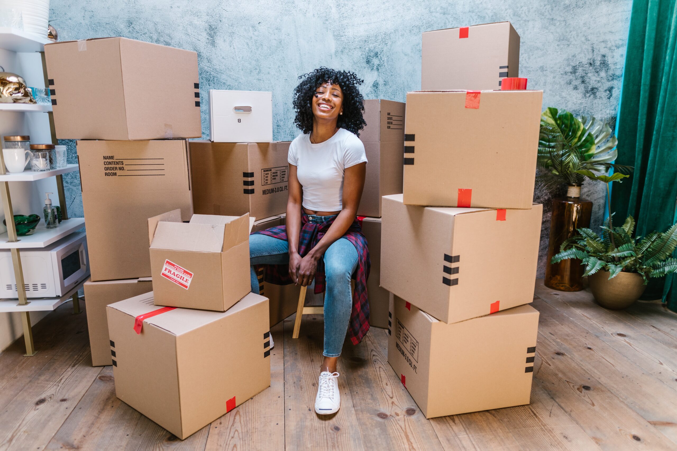 woman with boxes while moving