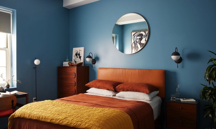 A bedroom with blue walls