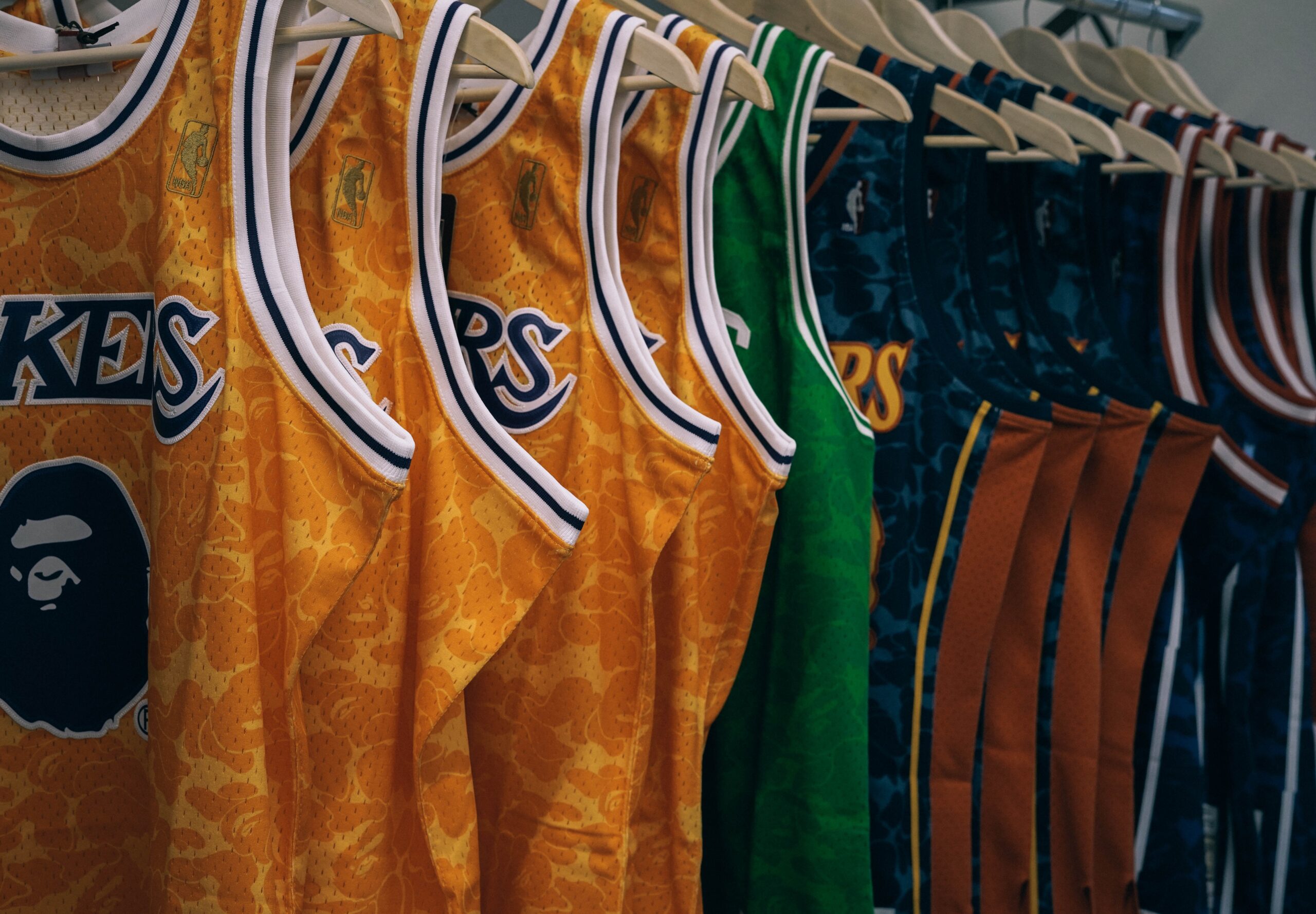 Sports jerseys and items for man cave ideas. Pictured: Lakers Jerseys.