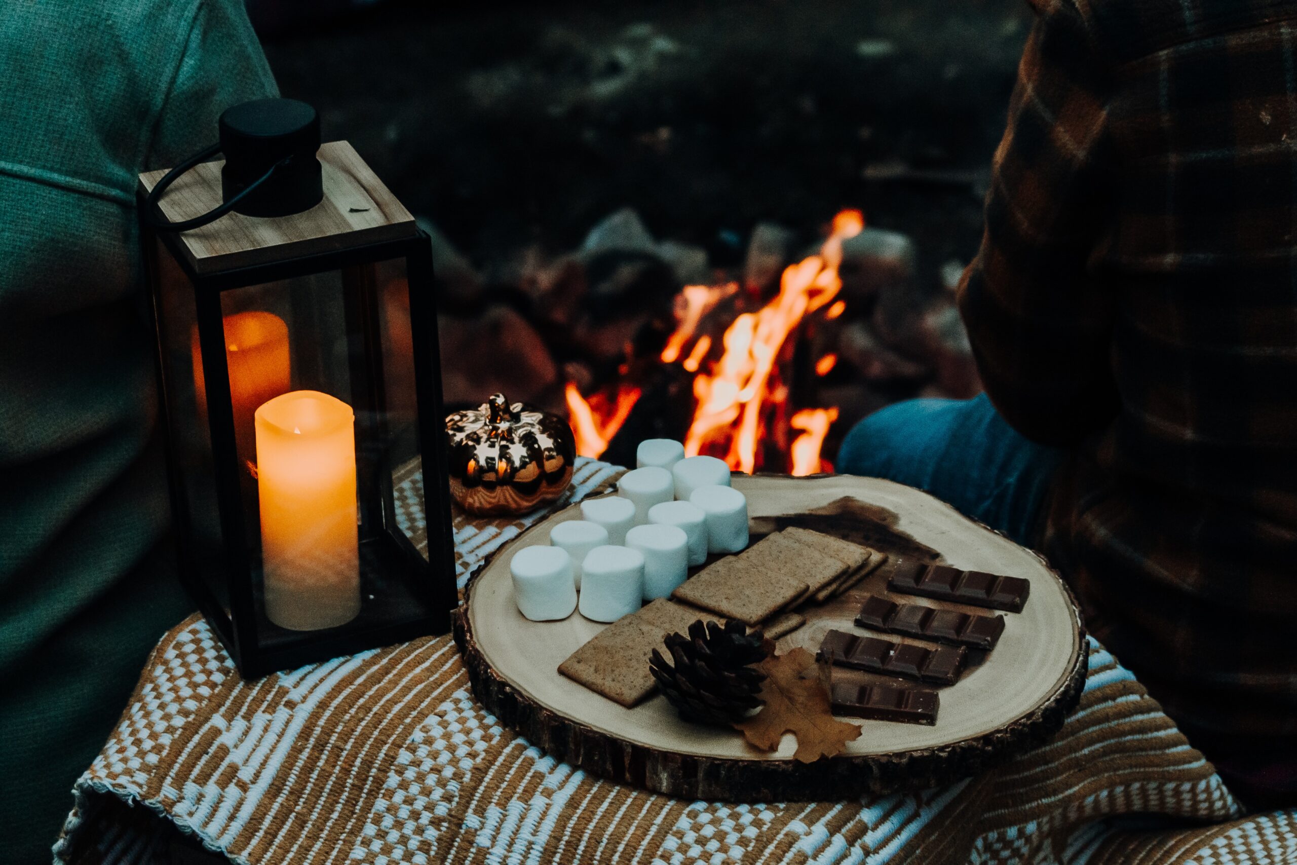 This fire pit seating idea allows you to create a romantic night under the stars. Pictured: A s'mores kit with a fireplace.