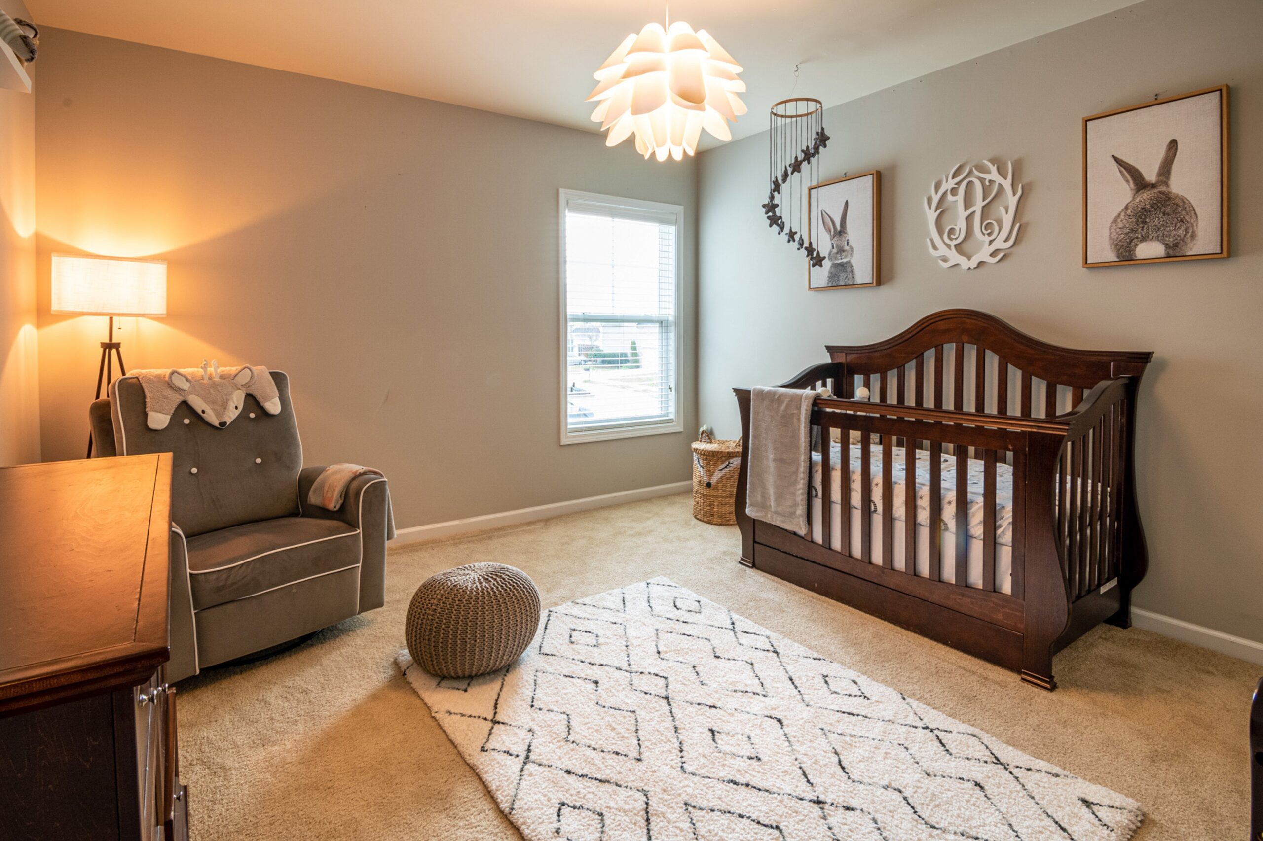 Baby room with wood crib and rocking chair