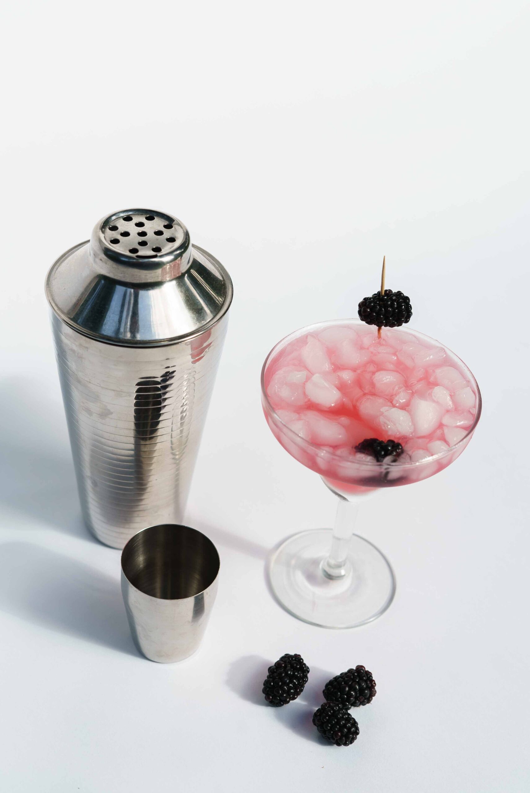Cocktail shaker with pink cocktail 