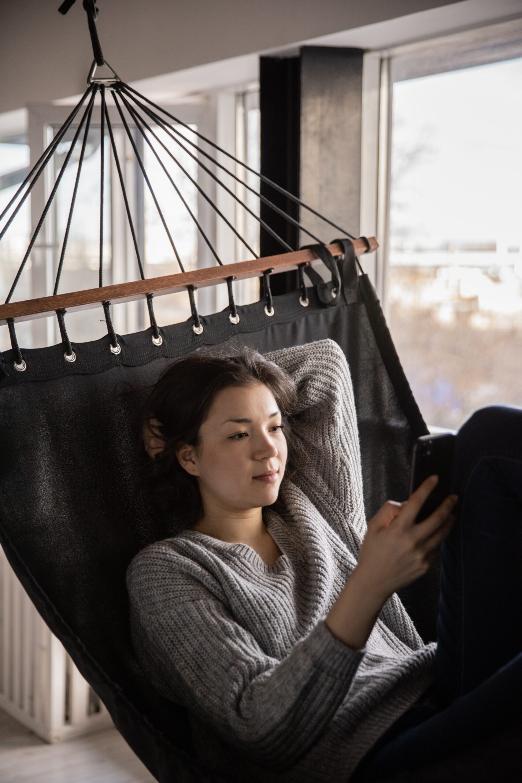 Woman reading in hammock