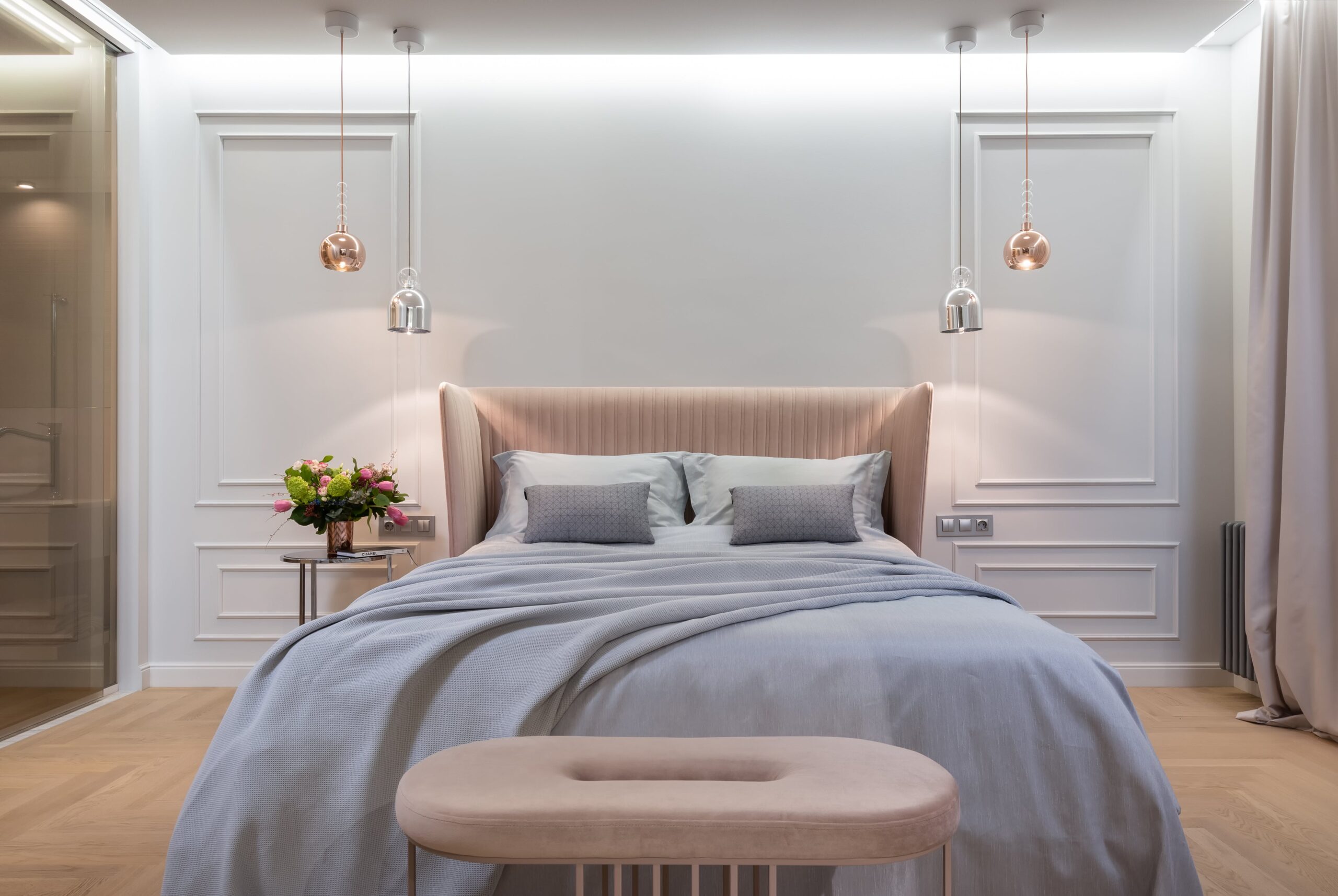 Use a plain white look for your bedroom color to have more flexibility in designing the space. Pictured: A bedroom with white walls and decor.