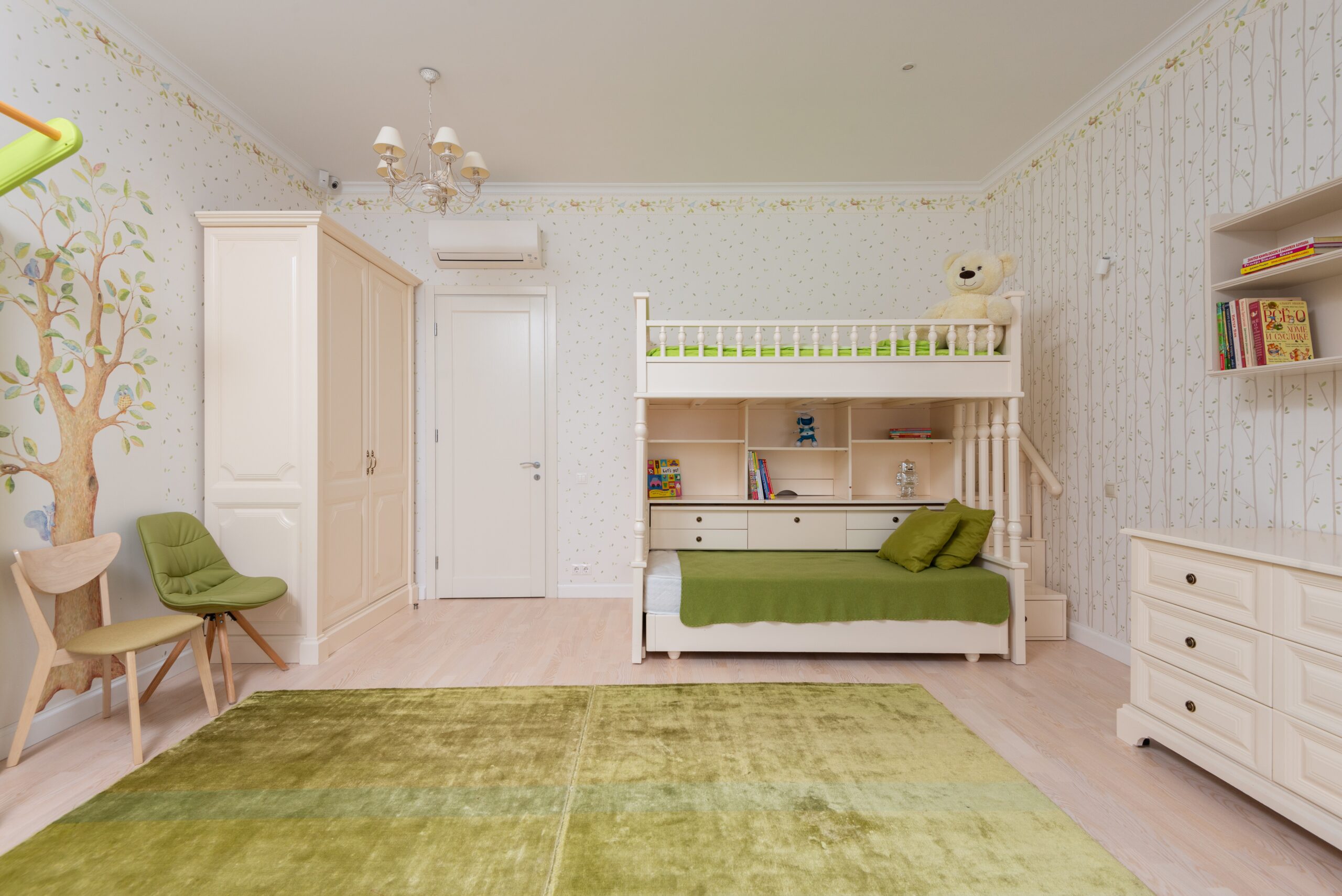A kid-friendly sage green bedroom idea. Pictured: A green bedroom.