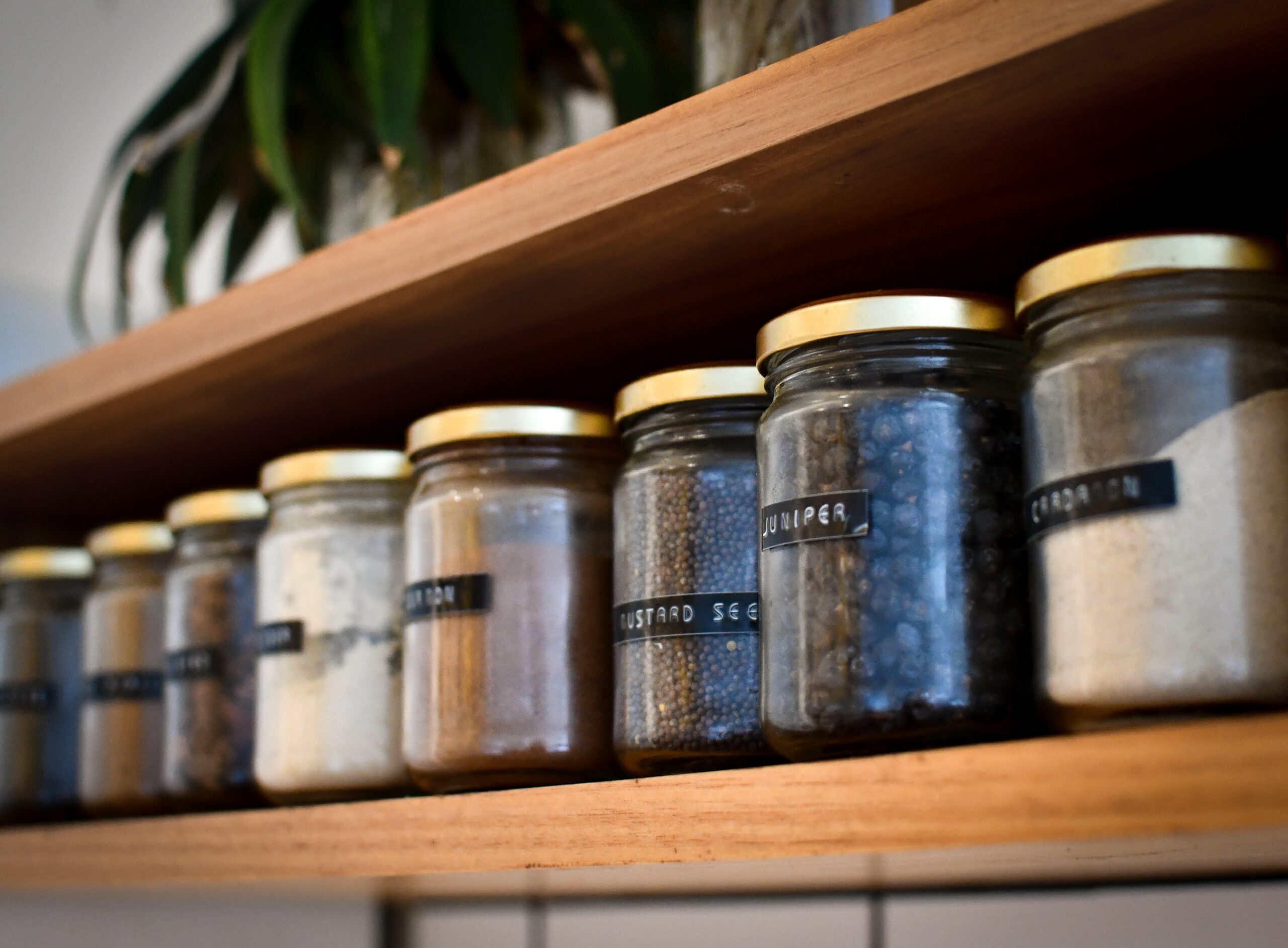 An assortment of spice jars on a shelf