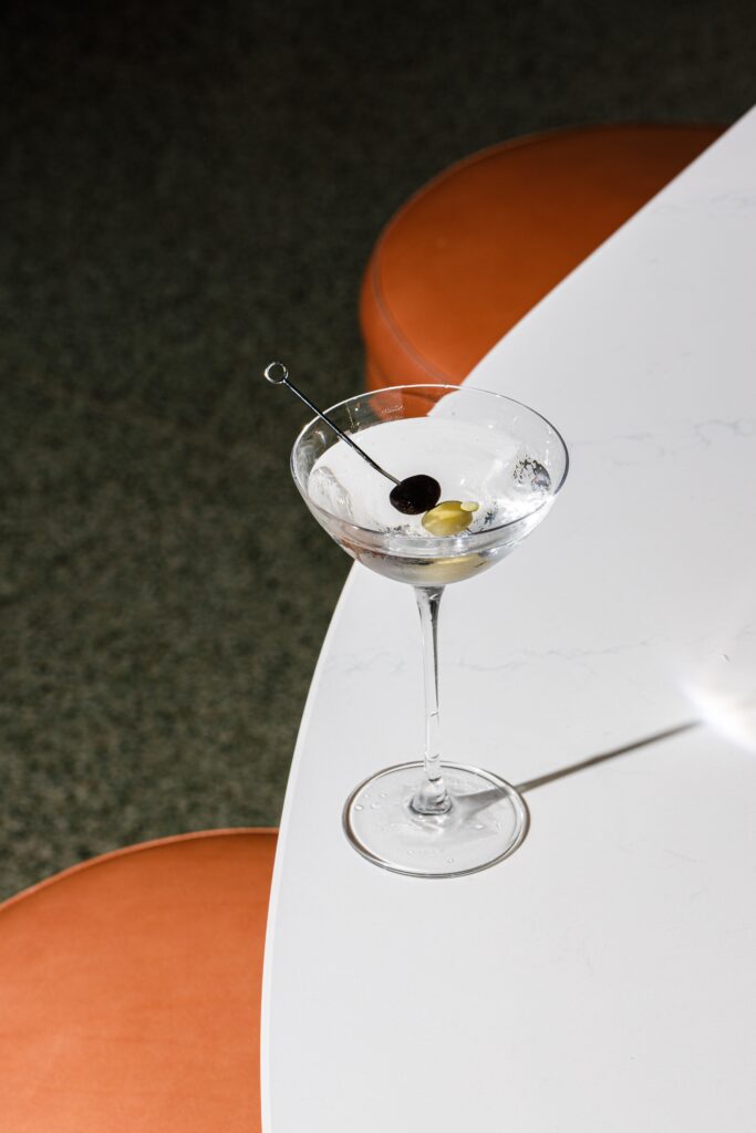 A martini with an olive for garnish