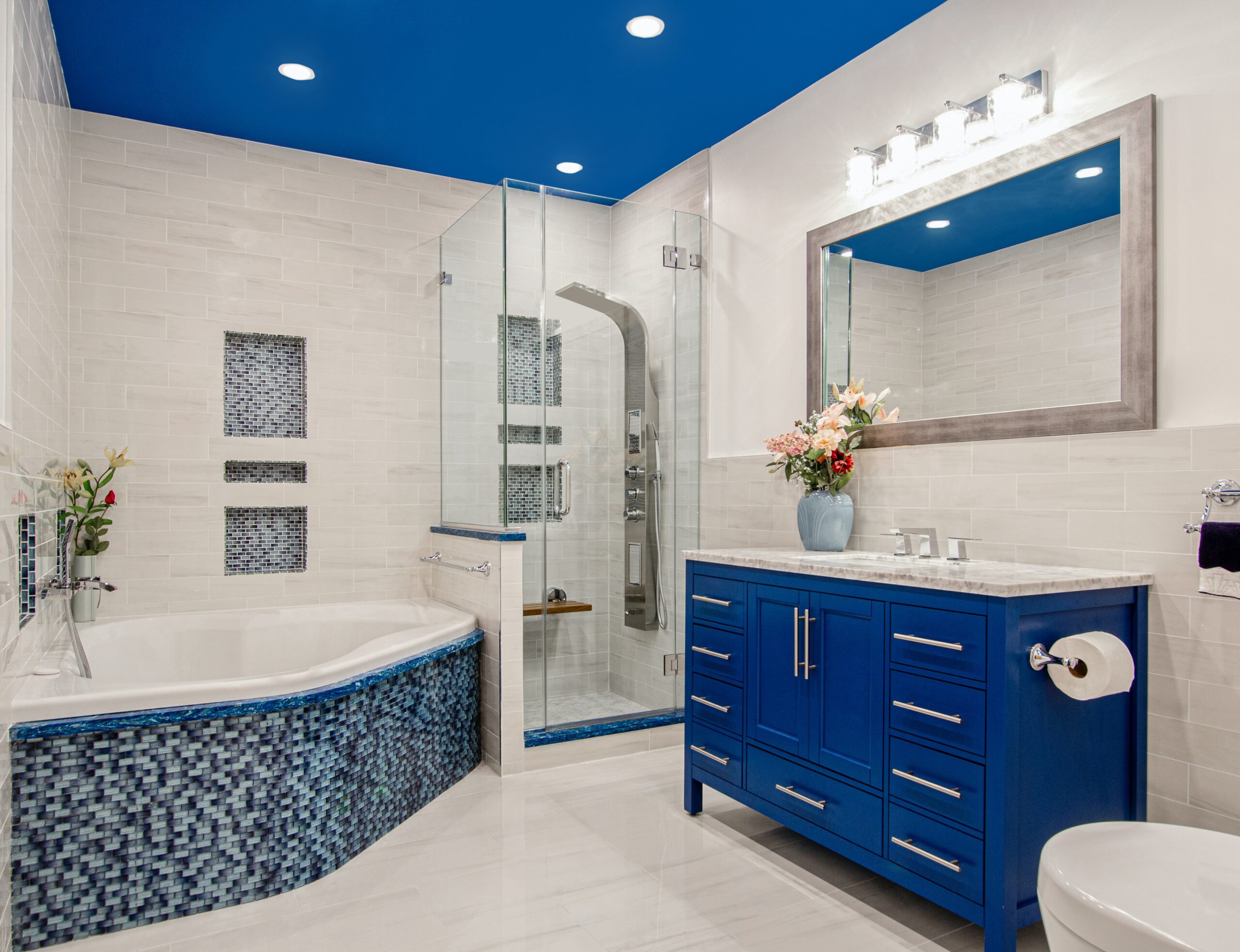 Add color to your boho bathroom to brighten it up. Pictured: A blue bathroom.