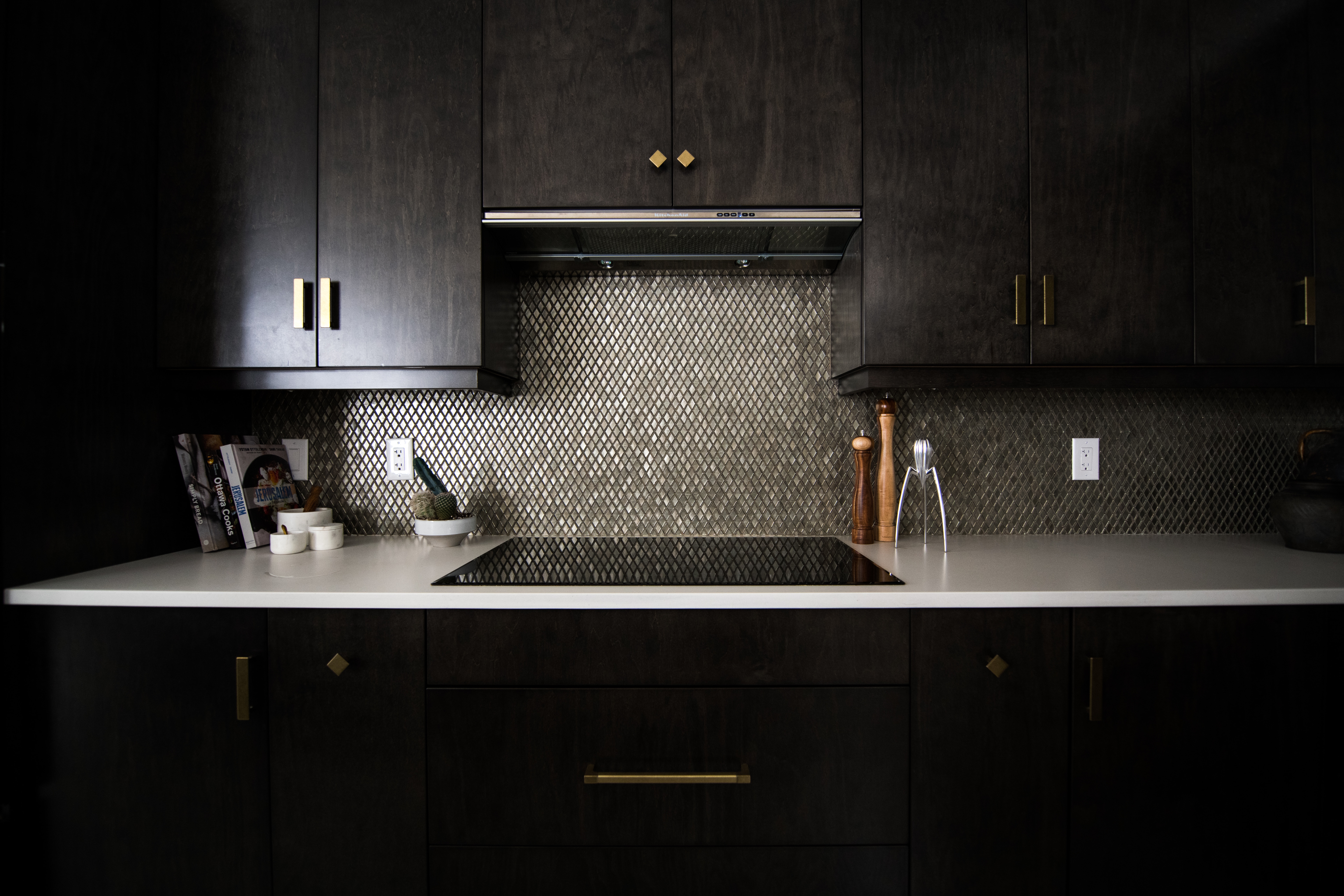 Consider black countertops with gold detailing for a classic and sophisticated look. Pictured: A black countertop with gold features.