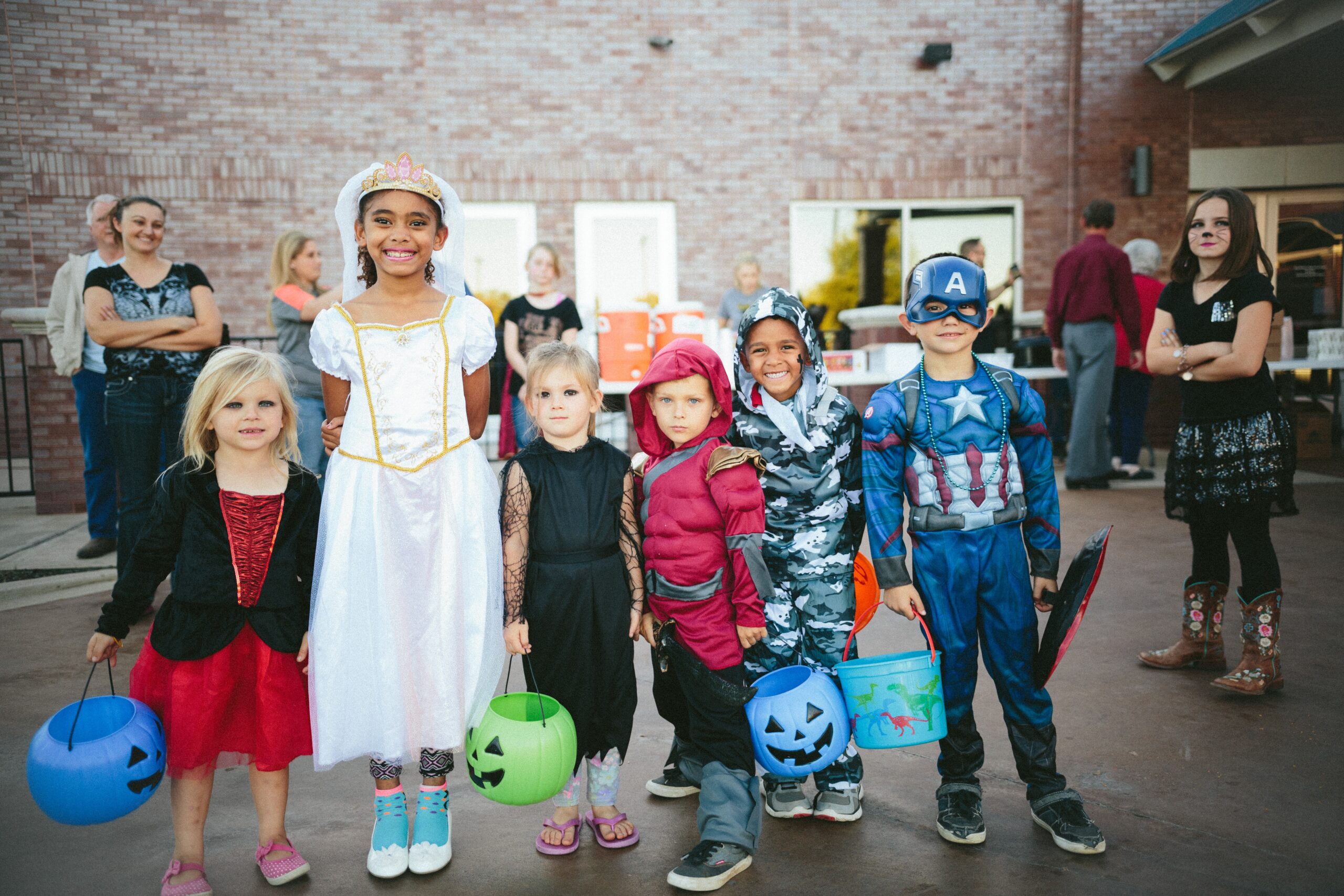 Display some of your favorite past or childhood costumes for a fashion Halloween aesthetic. Pictured: Kids in Halloween costumes.