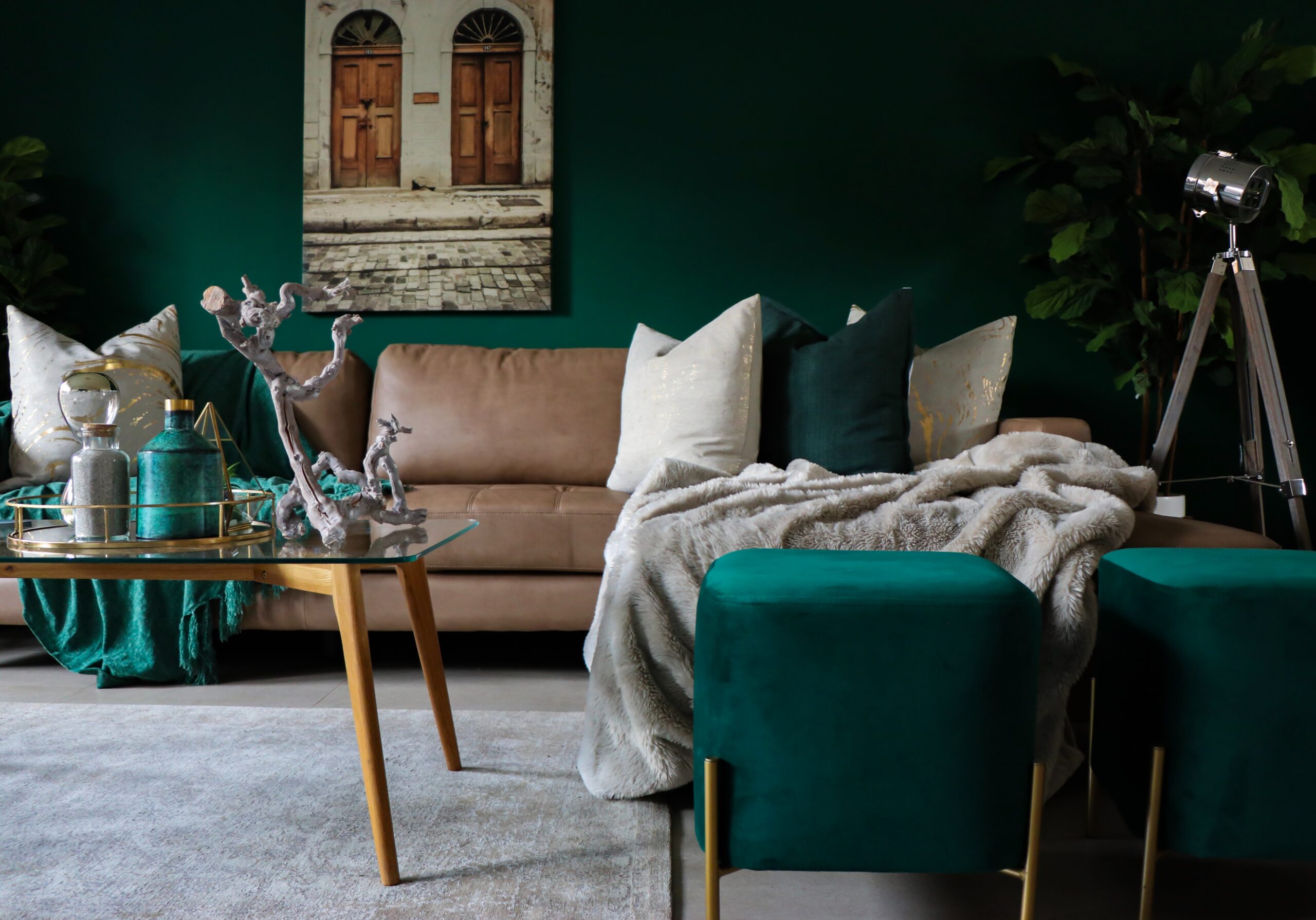Add some color to your living room space to incorporate feng shui practices. Pictured: A green living room.