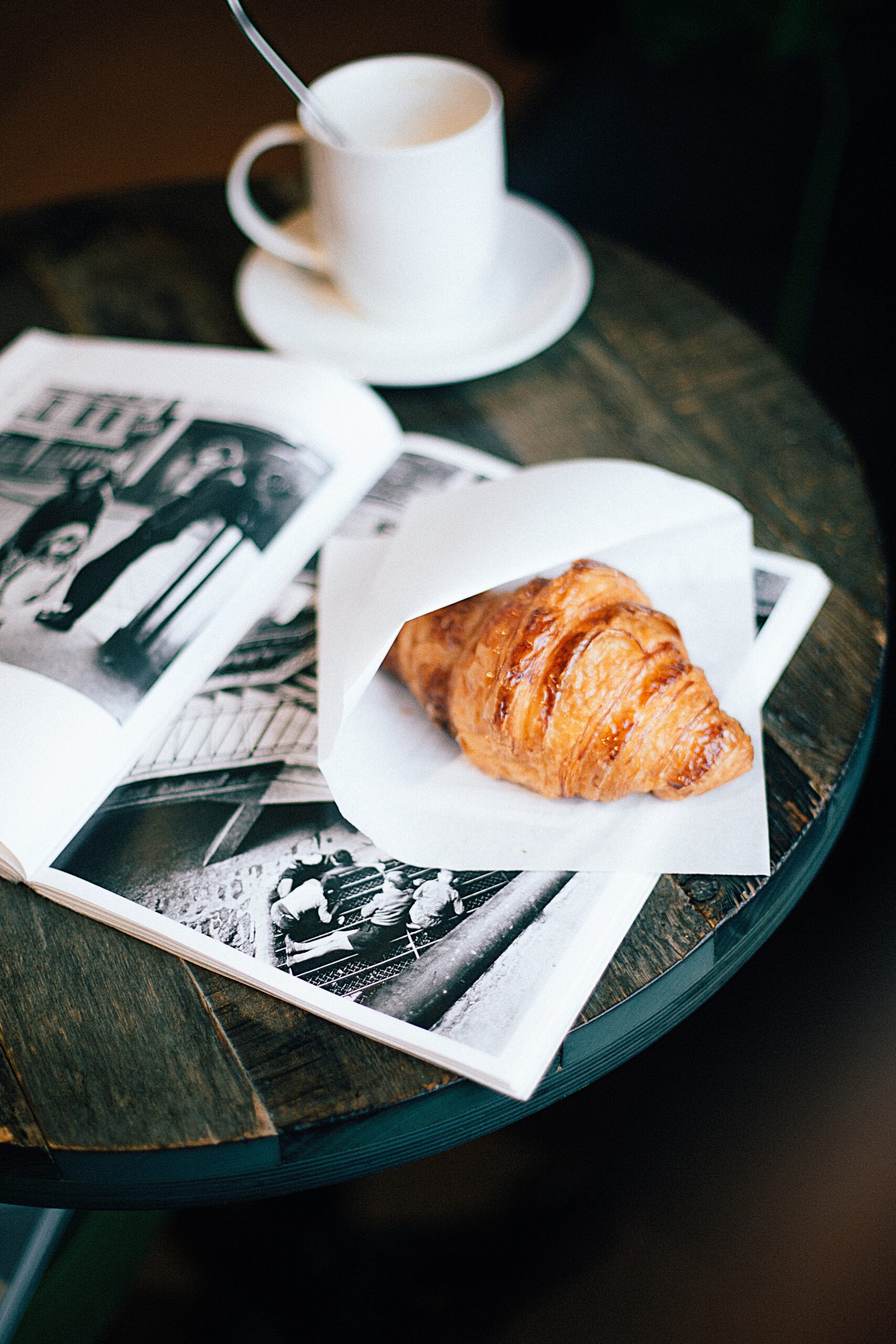 Croissant with coffee on table