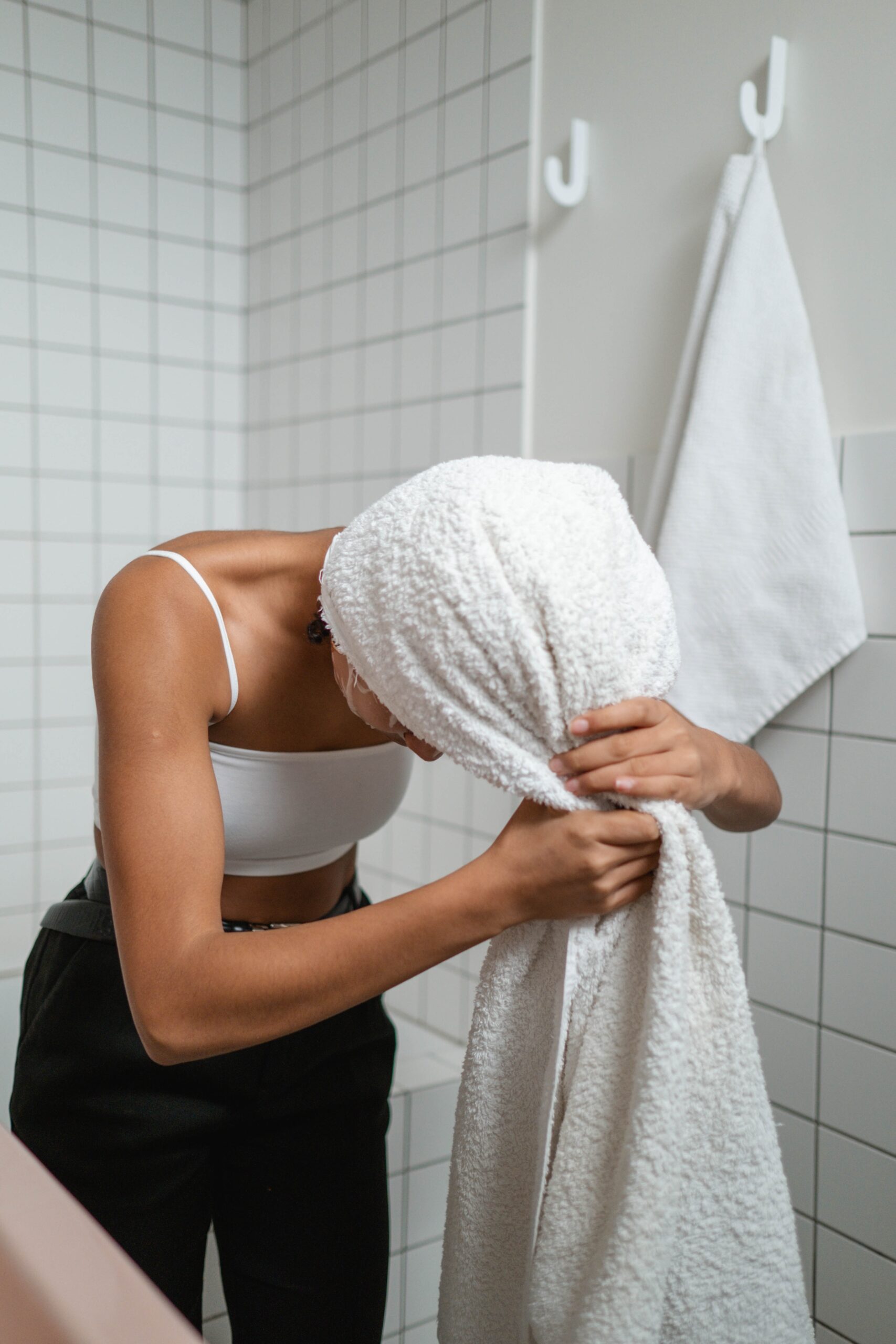 Woman wrapping hair in towel