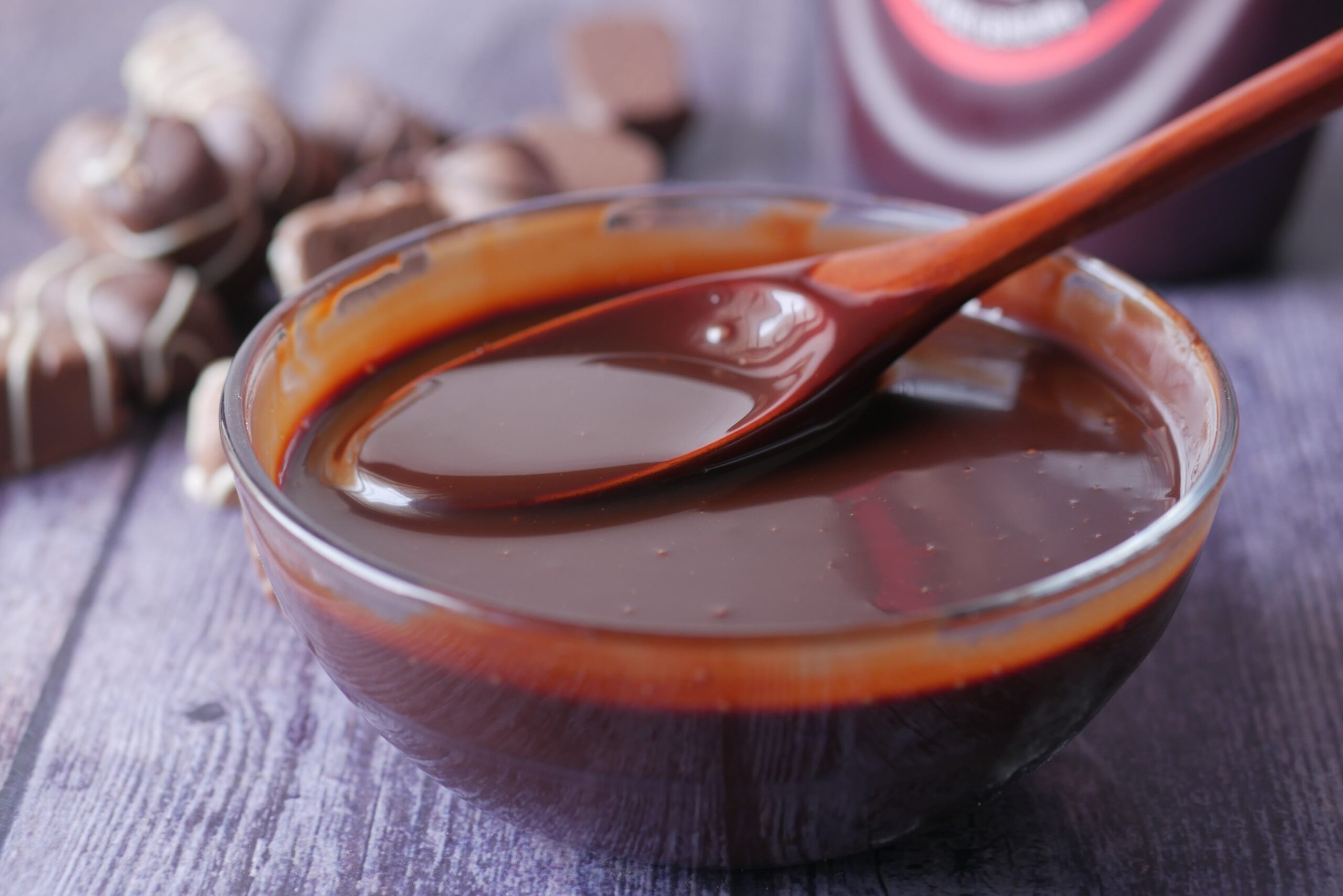 A closeup of a bowl of melted chocolate