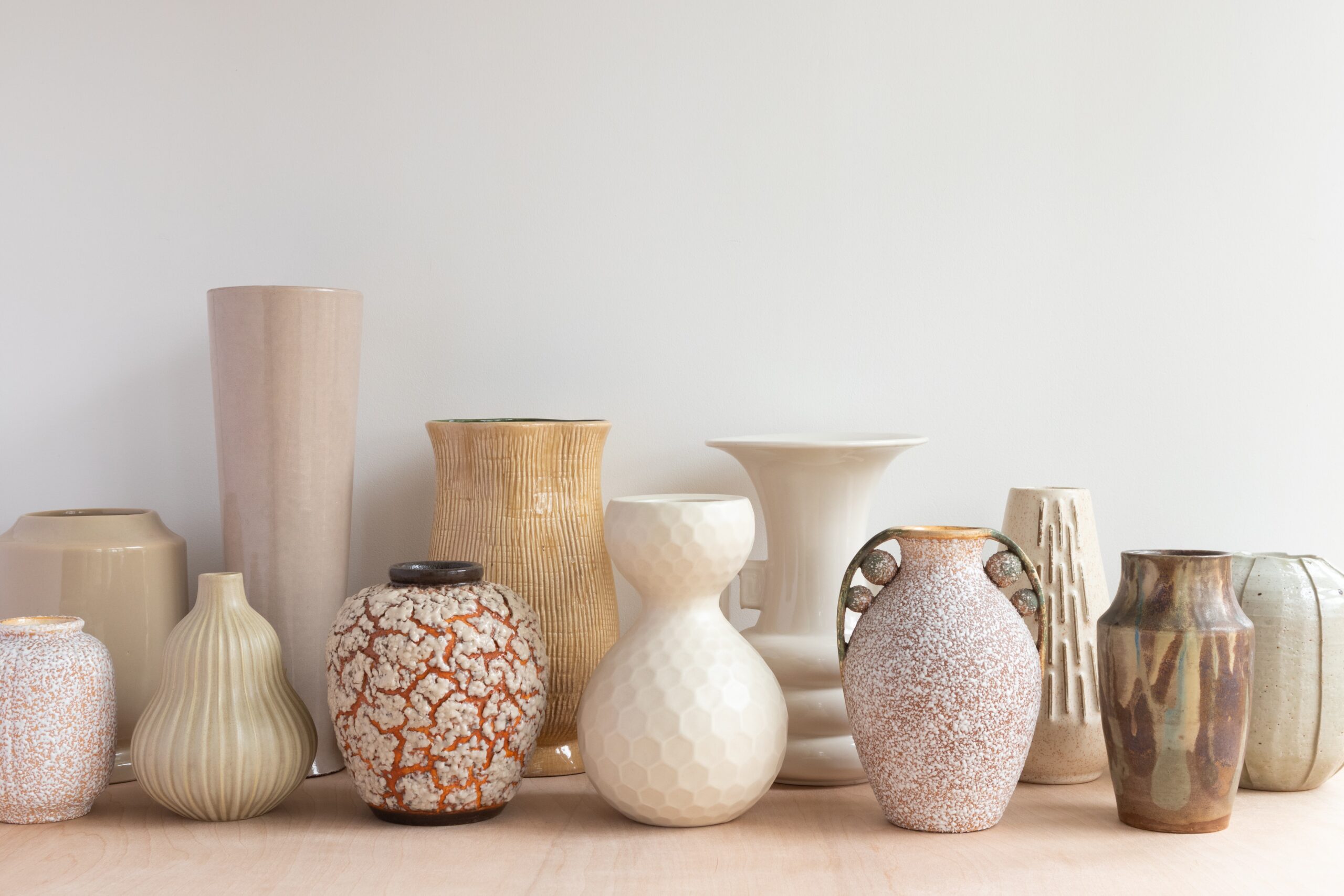 Cultural decor pieces can be a great way to utilize the boho aesthetic while celebrating other cultures and parts of the world. Pictured: Vases on a shelf.