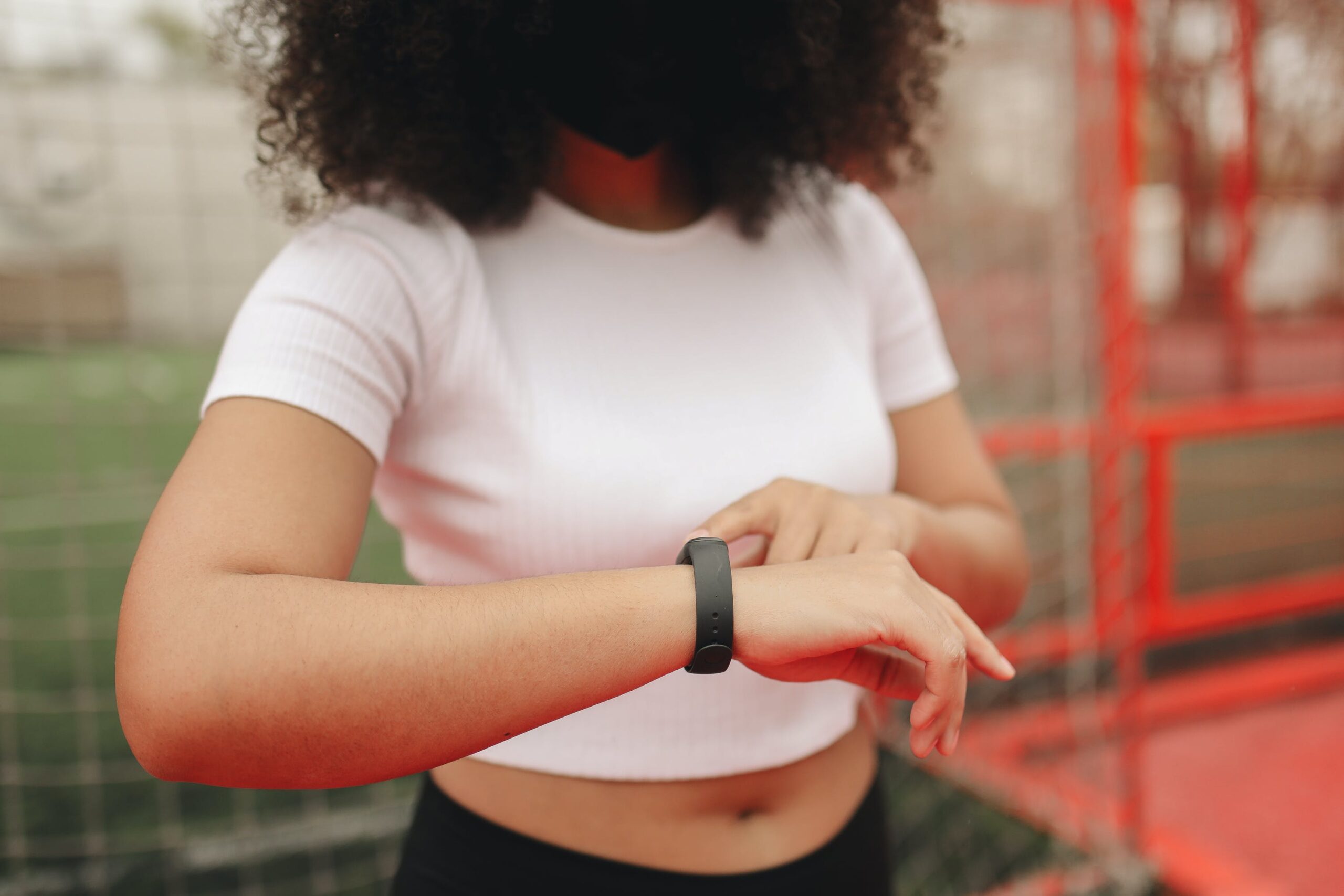 woman checking fitness tracker