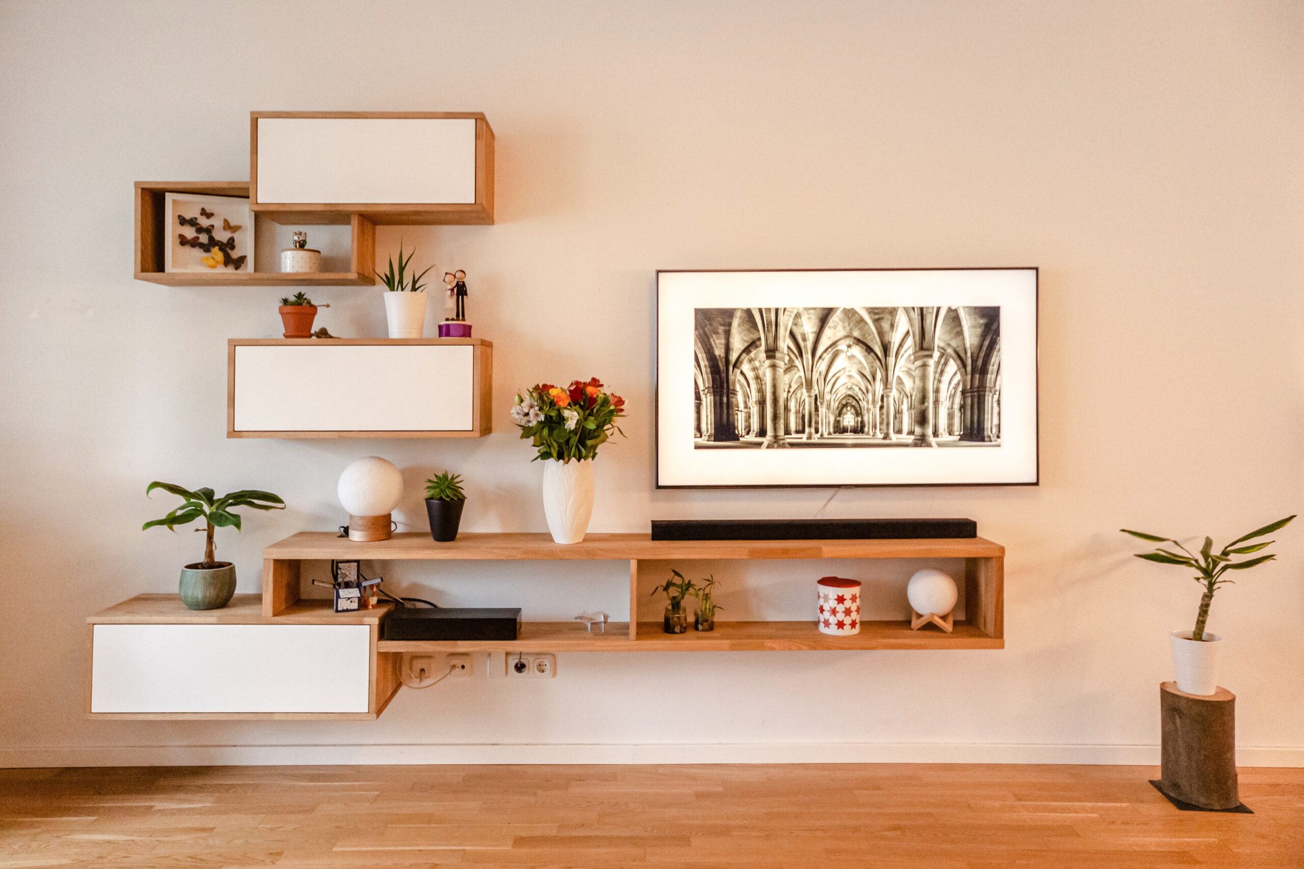 Utilize wood shelving, tables, decor and furniture to combine a boho style and organic modern design in your home. Pictured: Wood shelving with decor.