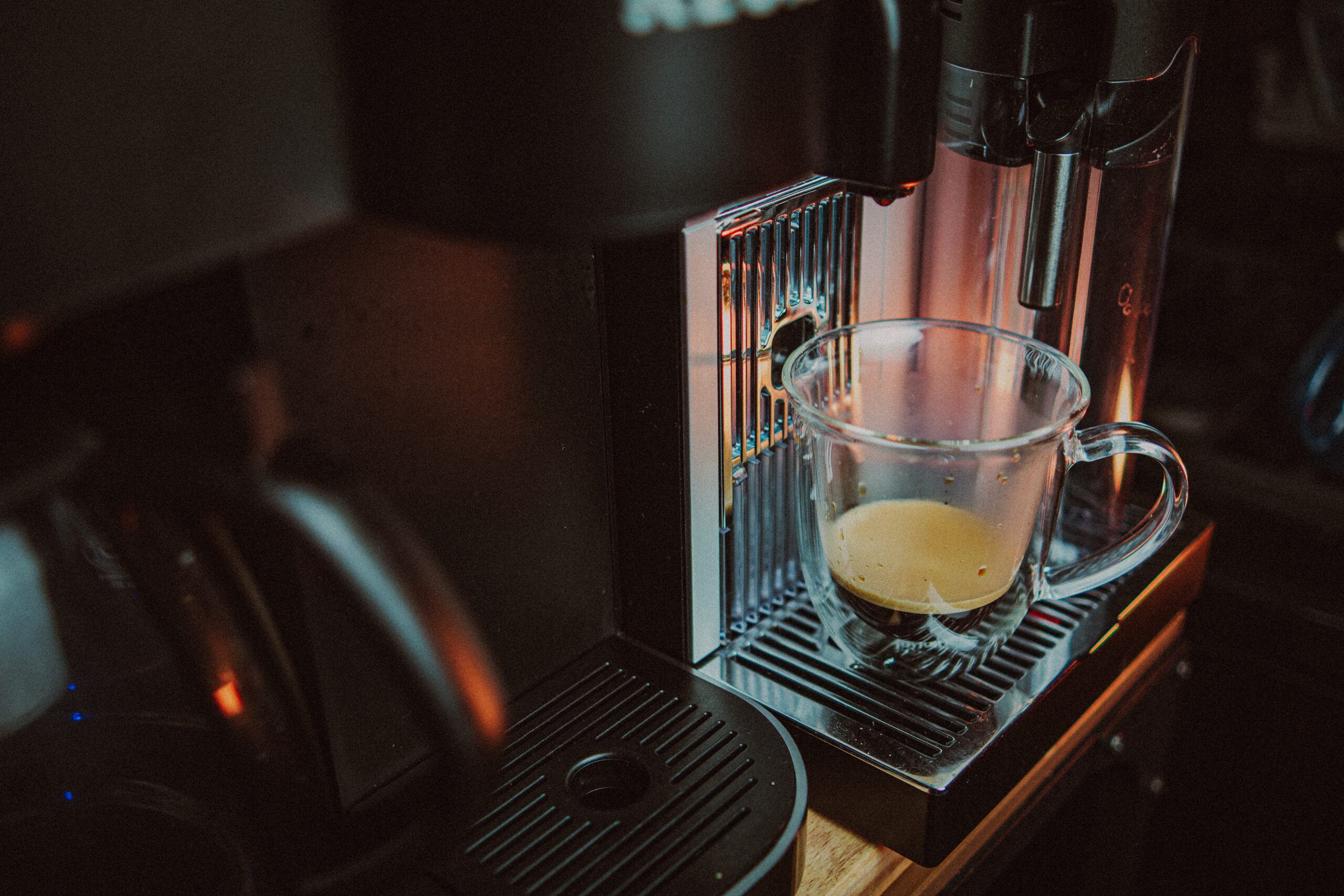 Install an at-home coffee bar with a coffee machine, syrups, a topping station, mugs and decor. This kitchen trend has been all over TikTok and will continue to be a trend in 2024. Pictured: A coffee machine.