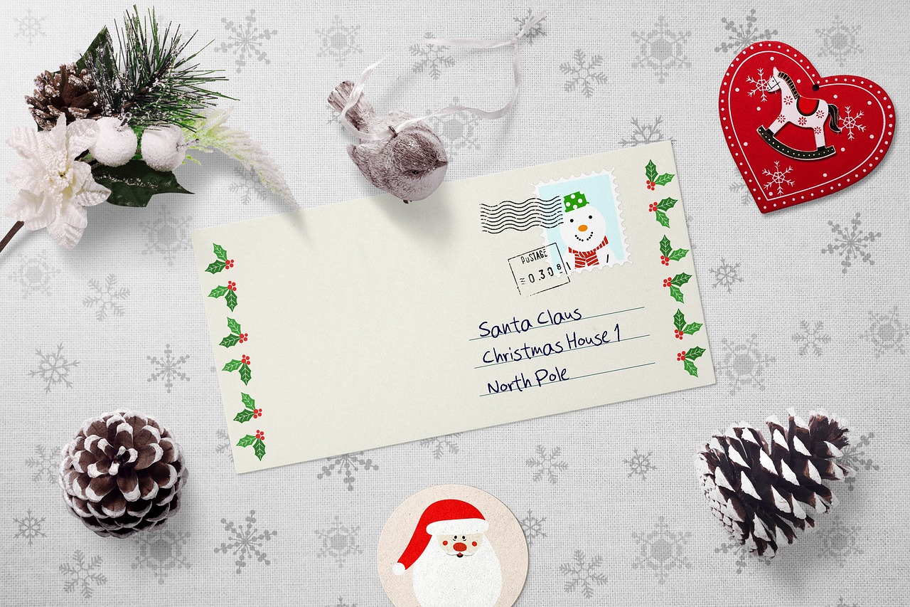 Create a letters to Santa Christmas tree theme by adding letters, mailboxes, garland and a cute Santa plush figure for fun! Pictured: Letters to Santa.