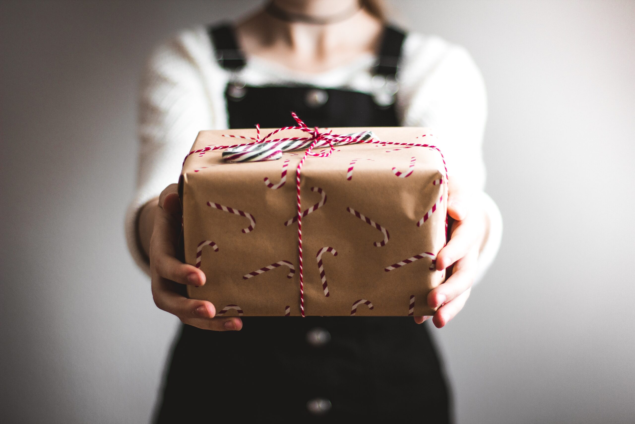 DIY wrapping paper is a great Christmas craft for the kids to enjoy and will bring out their creative side. Pictured: A gift wrapped in Christmas wrapping paper