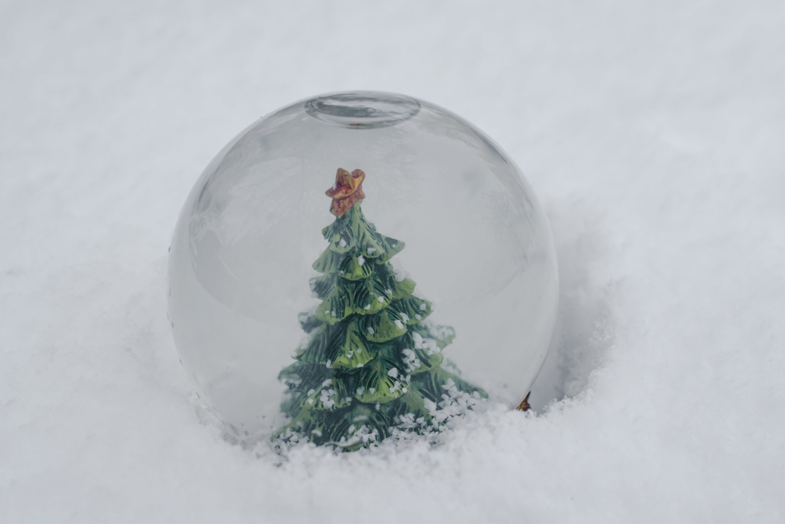 A waterless snow globe is the perfect mess-free DIY Christmas craft for the kids. Pictured: A Christmas snow globe