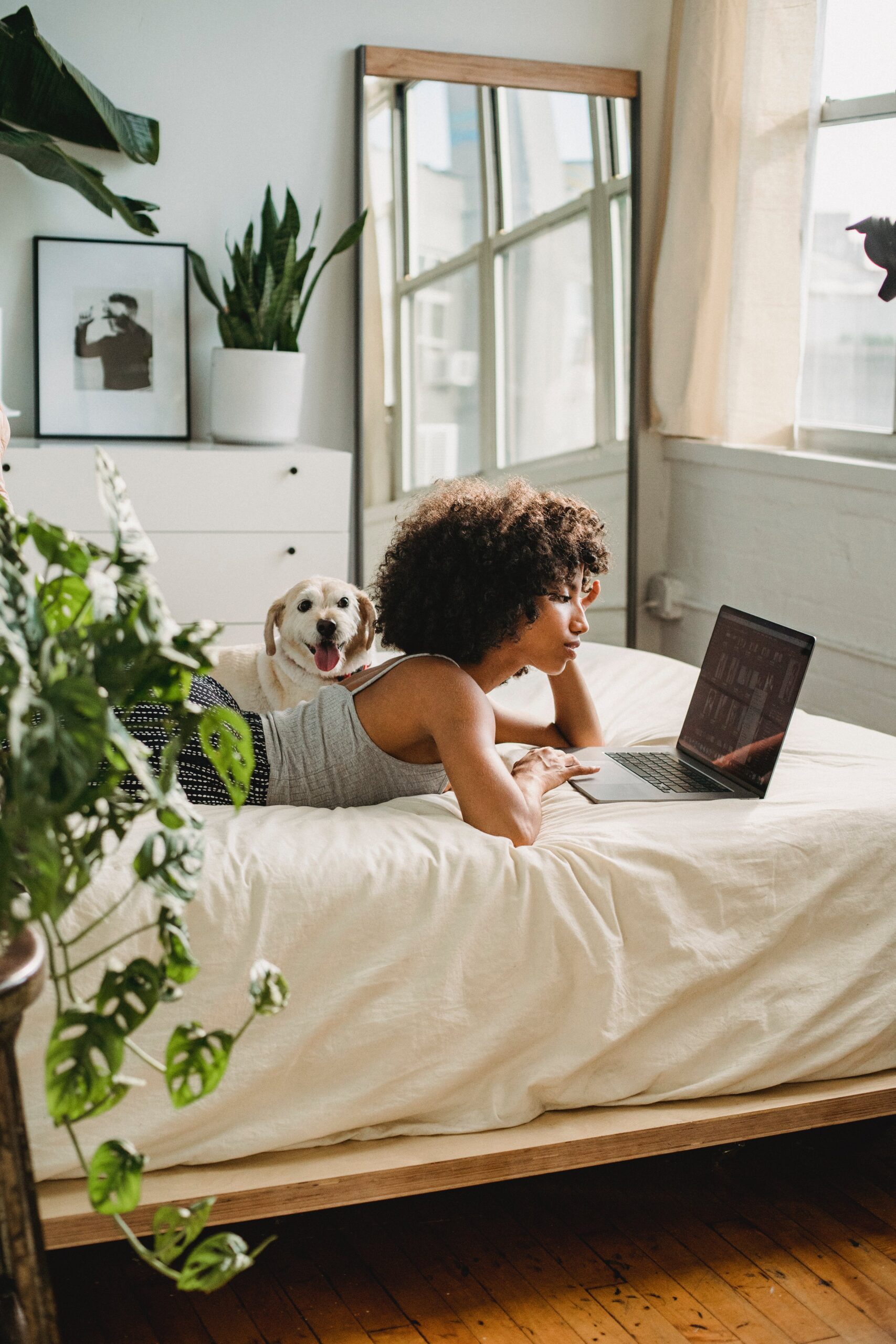 Woman and dog on laptop