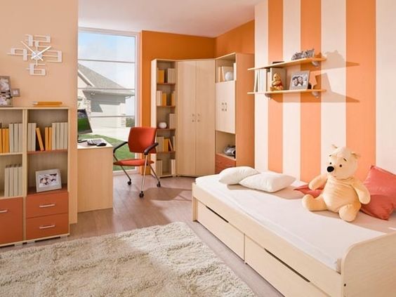 Use pastel shades of orange and purple to create a warm and sunny room. Pictured: A peach and white striped bedroom.