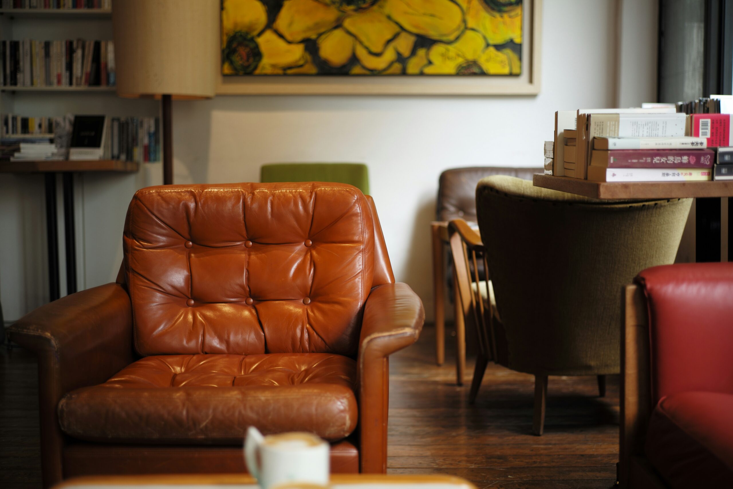 Get rid of odd stains like gum or ink by learning how to clean your leather couch. Pictured: A leather chair in a room
