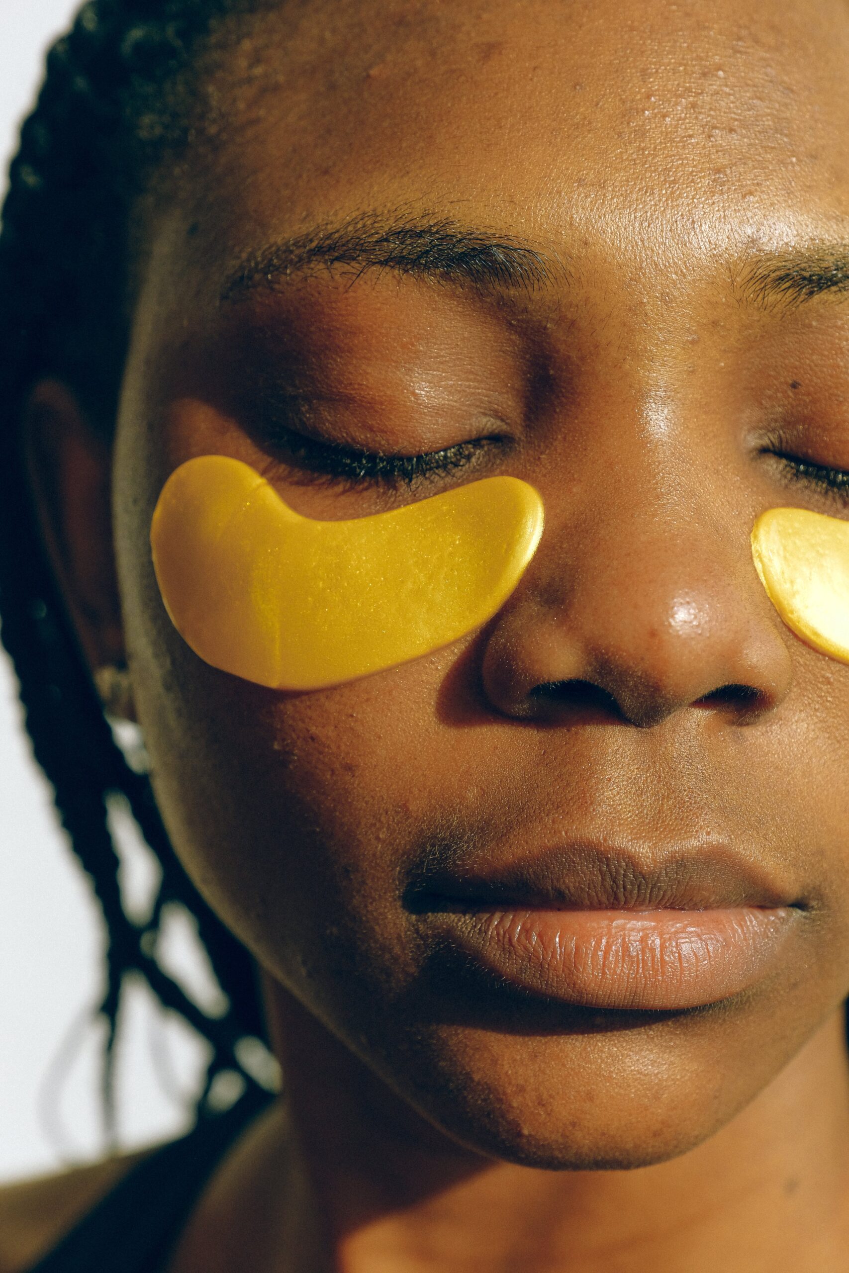 Woman with skincare eye patches