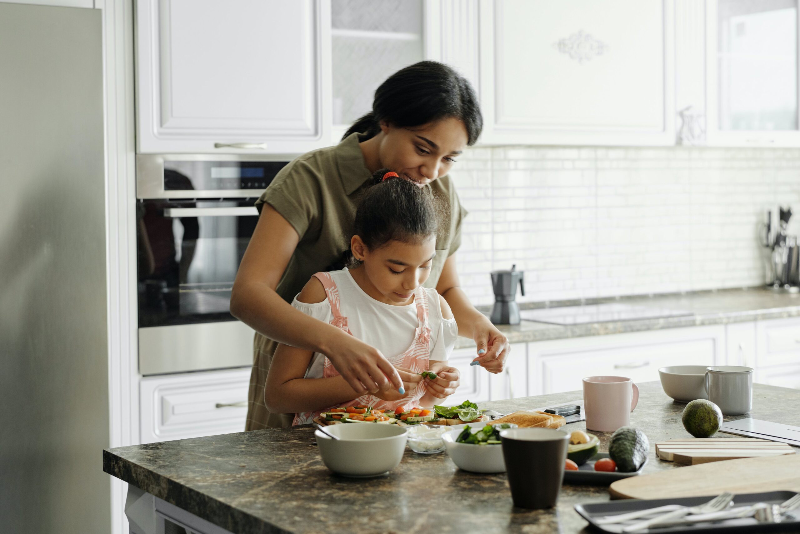 Mom cooking with daughter 