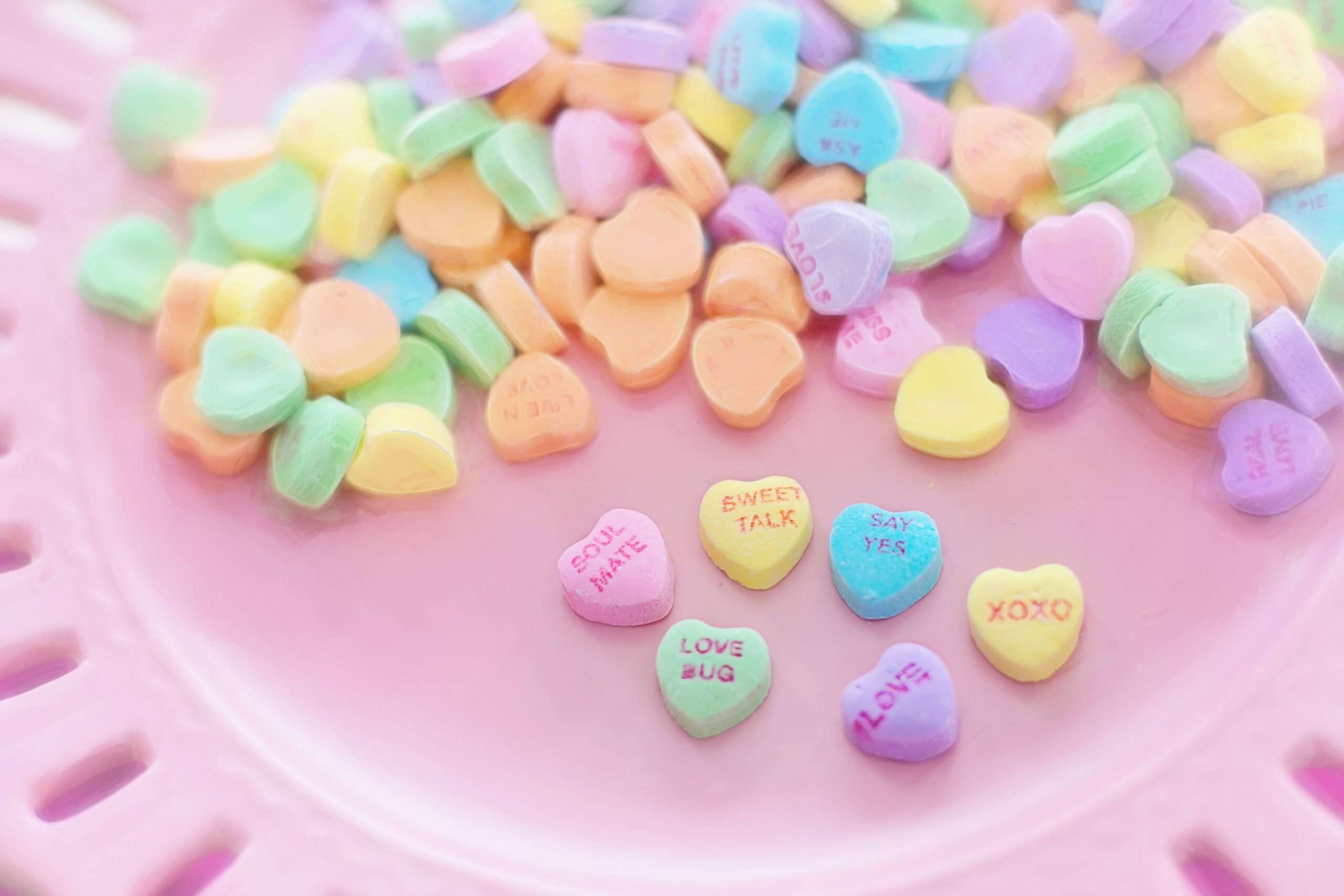 The Valentine's Day Candy Salad is perfect for events, Galentine's Day, hosting and more. Pictured: Conversation hearts candy