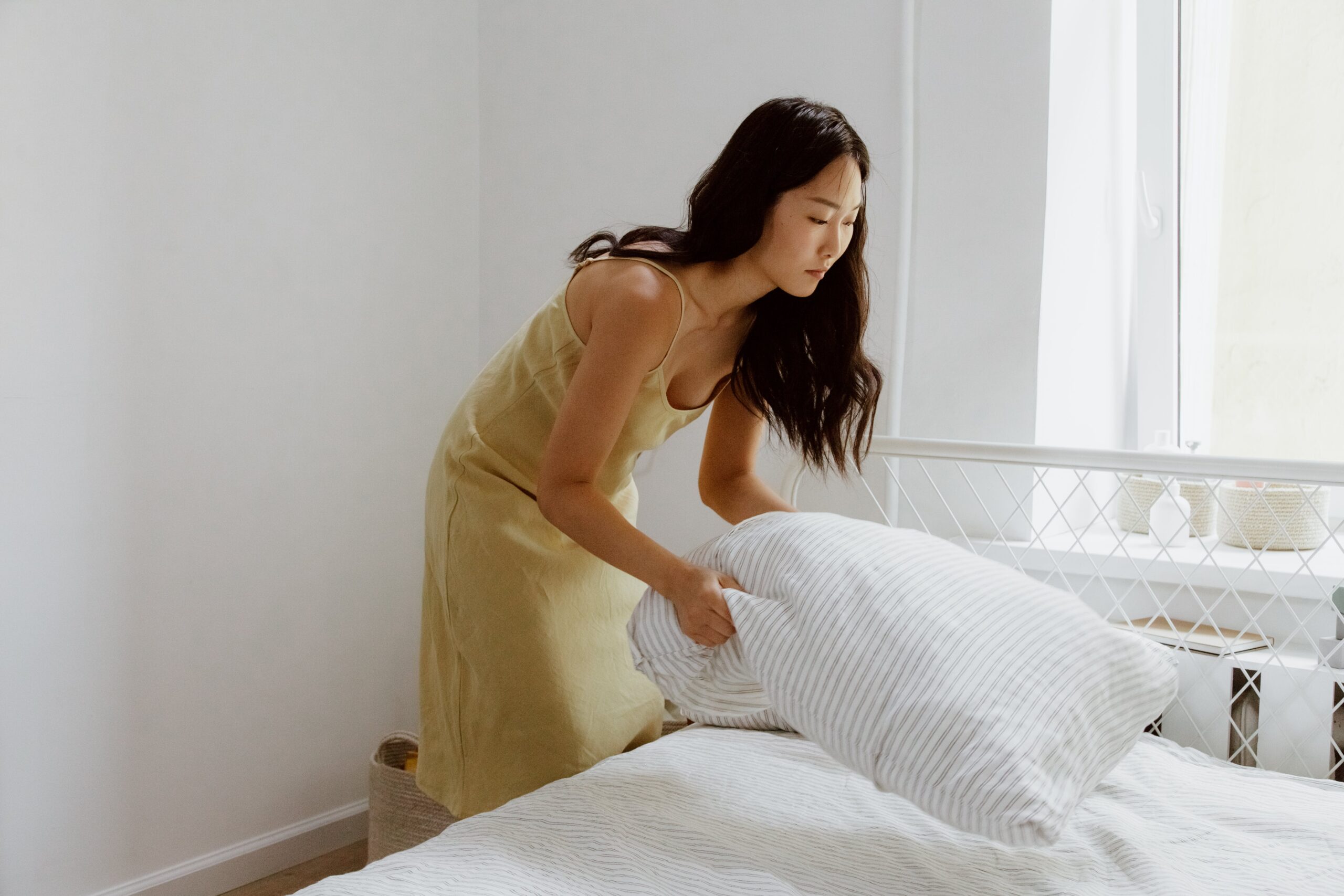 woman making the bed