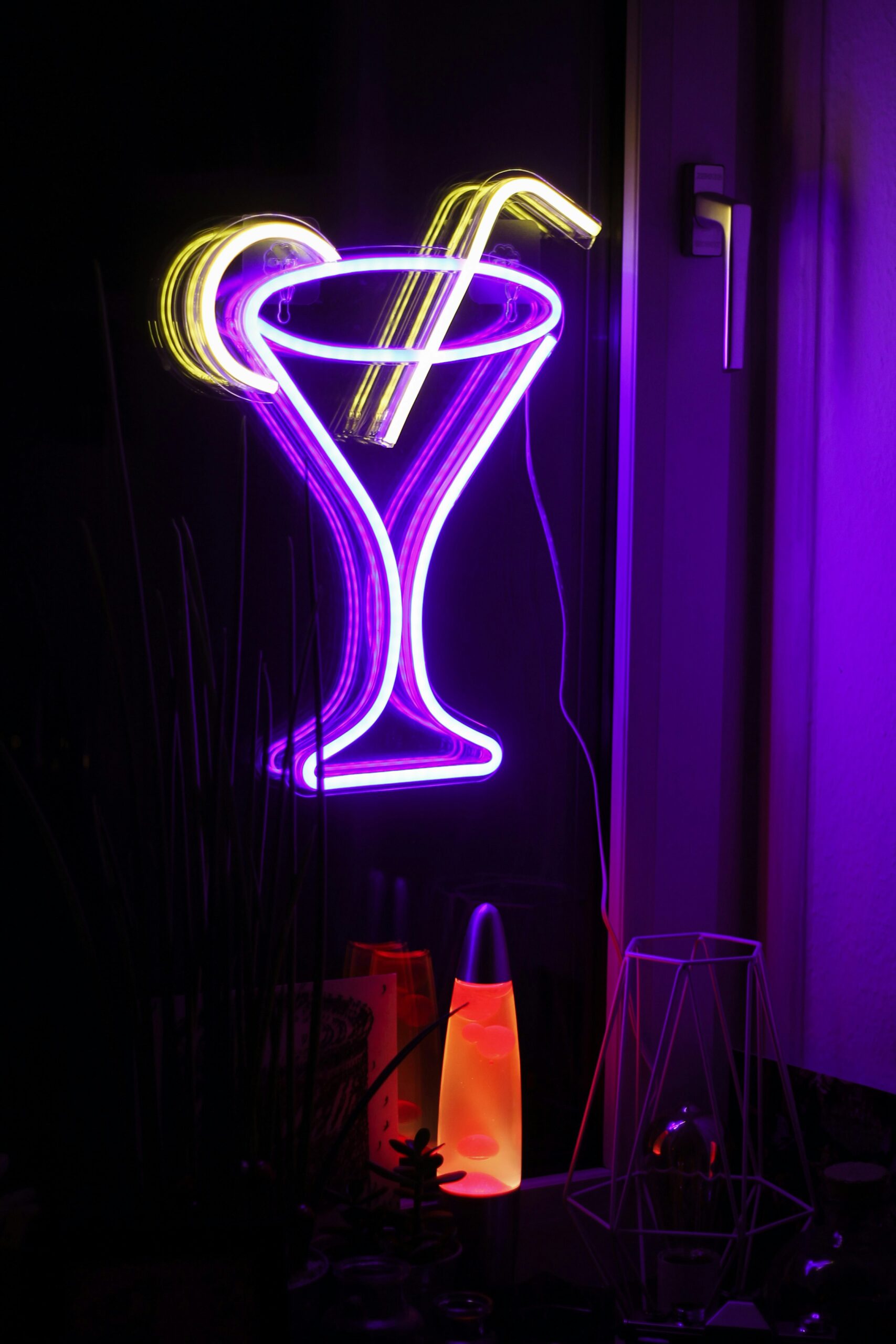 A neon sign and lava lamp