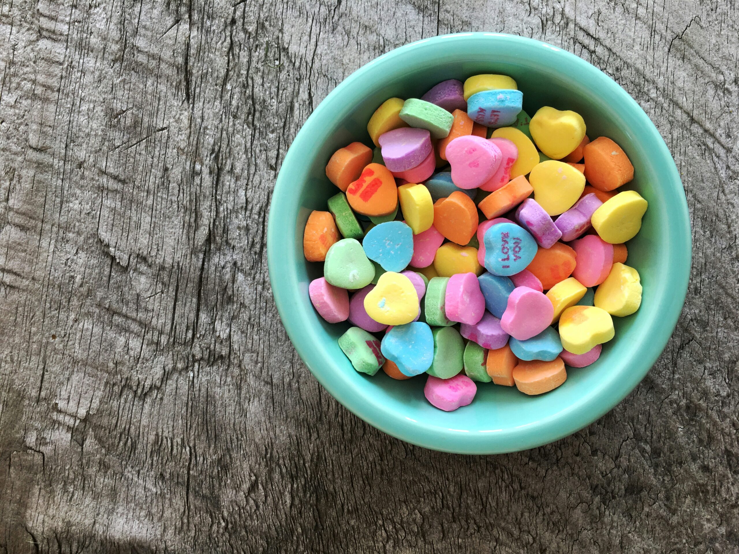 Make this conversation hearts love mocktail for a fun Galentine's day celebration. Pictured: Conversation hearts