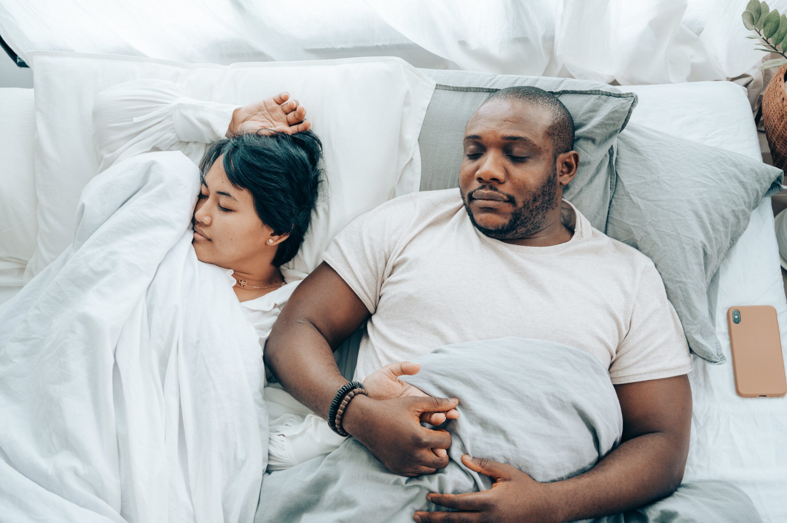 couple sleeping with weighted blanket