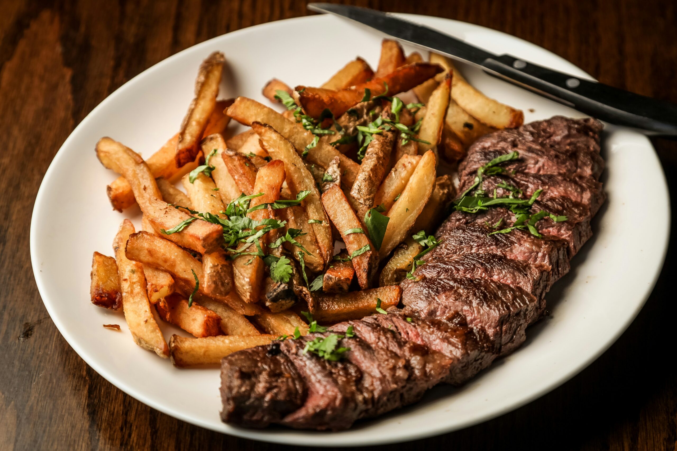 Ribeye steak is a classic Valentine's Day dinner idea. Pictured: Ribeye steak and fries