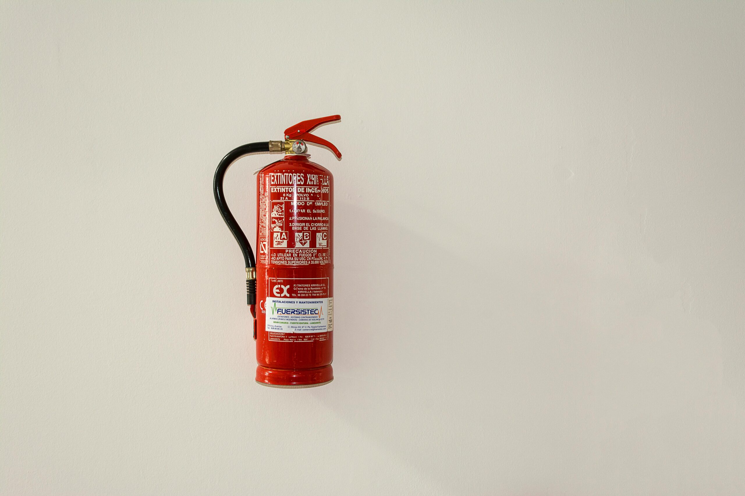 A fire extinguisher mounted on a wall