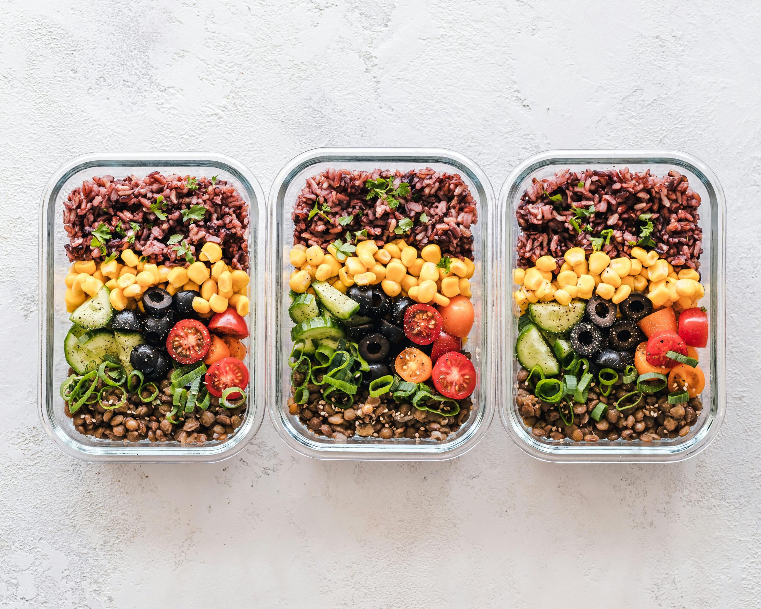 Three prepared meals in containers