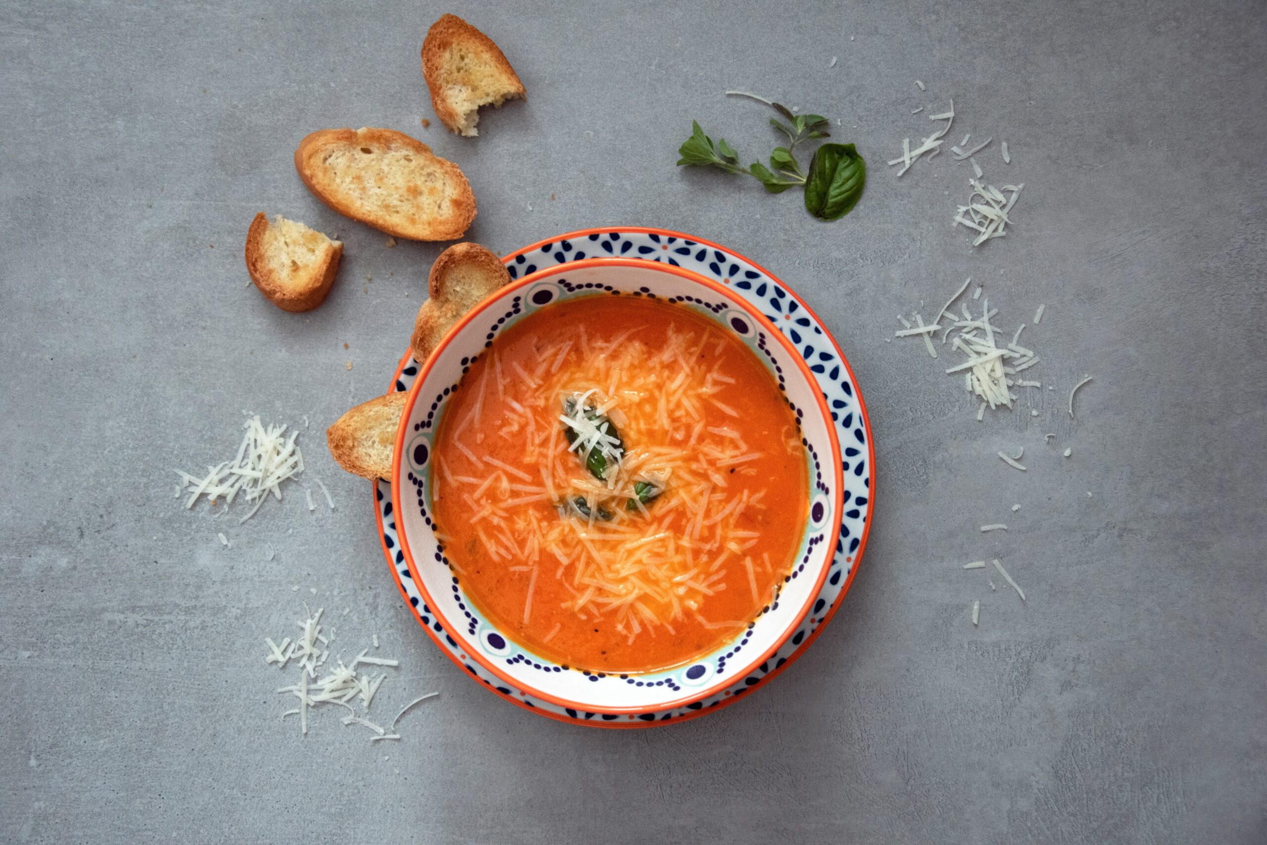 Here's what you'll need to make the TikTok viral Lasagna soup. Pictured: Soup with parmesan and basil