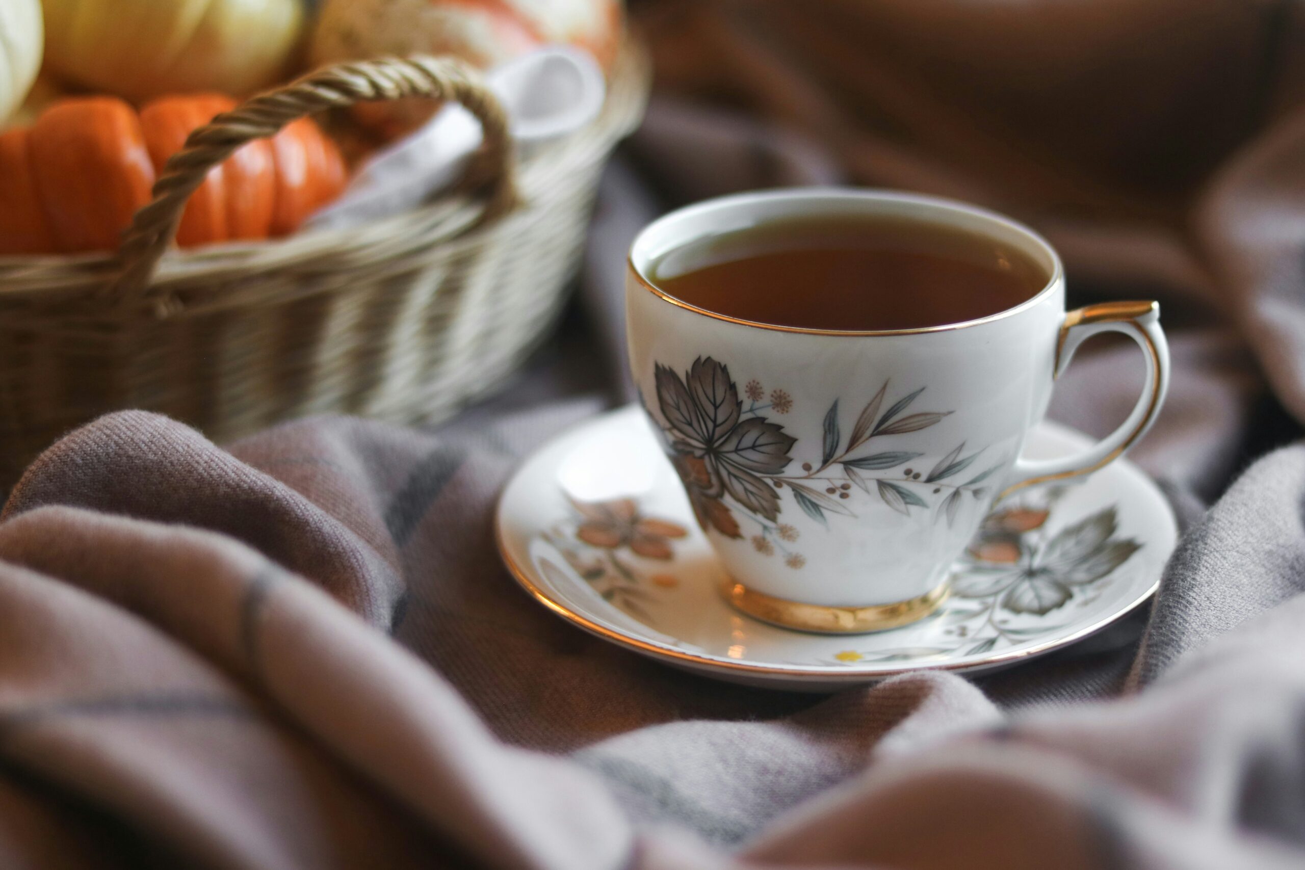 Use vintage decor to create a cottagecore aesthetic. Pictured: A vintage teacup with tea