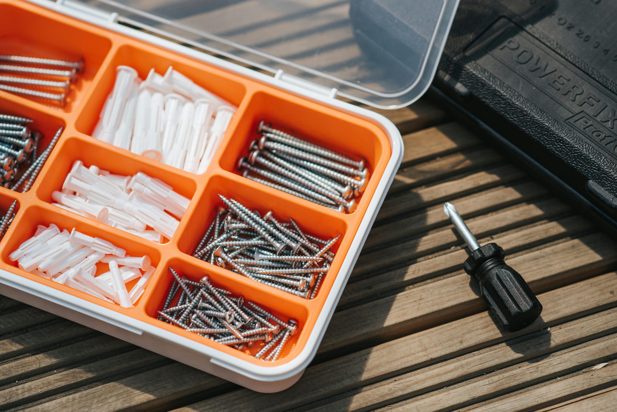 A toolkit filled with multiple screws