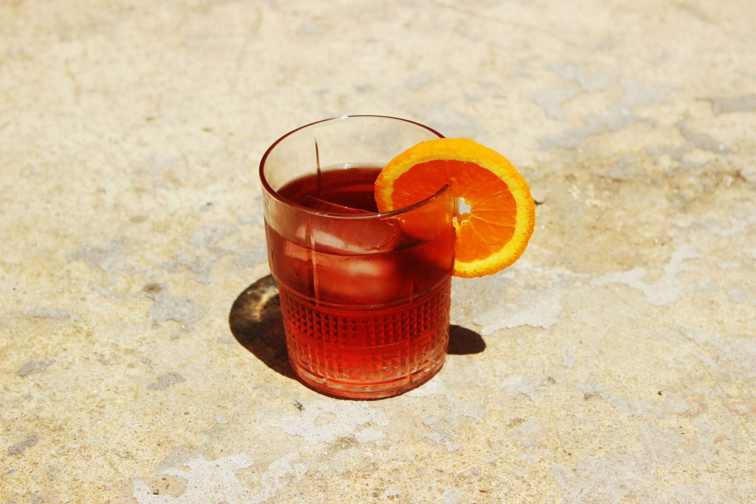 This solar eclipse cocktail is the perfect balance of fruity with a strong alcoholic taste. Pictured: An orange cocktail