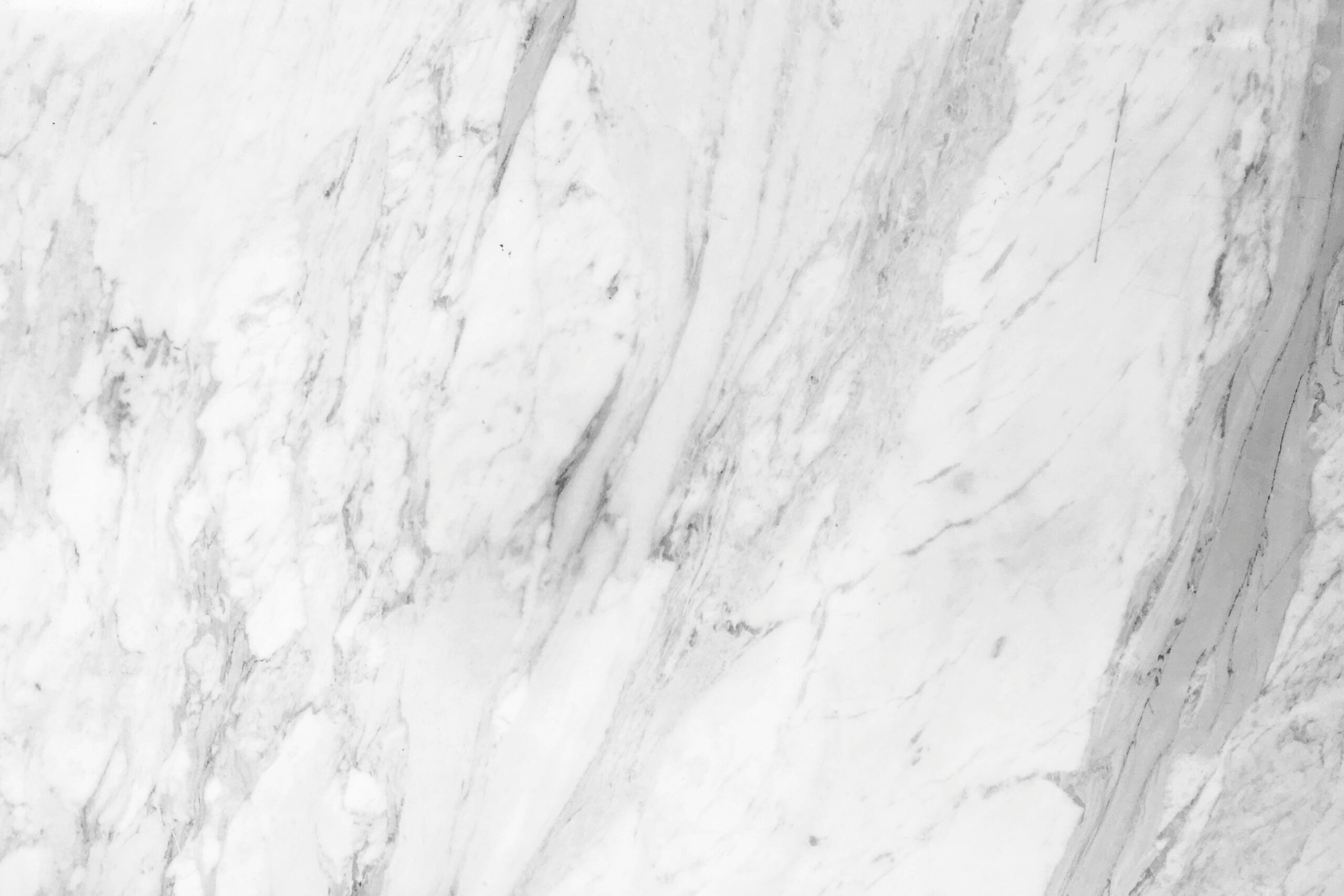 Here are the pros and cons of using white Venetian plaster. Pictured: A marble plaster wall