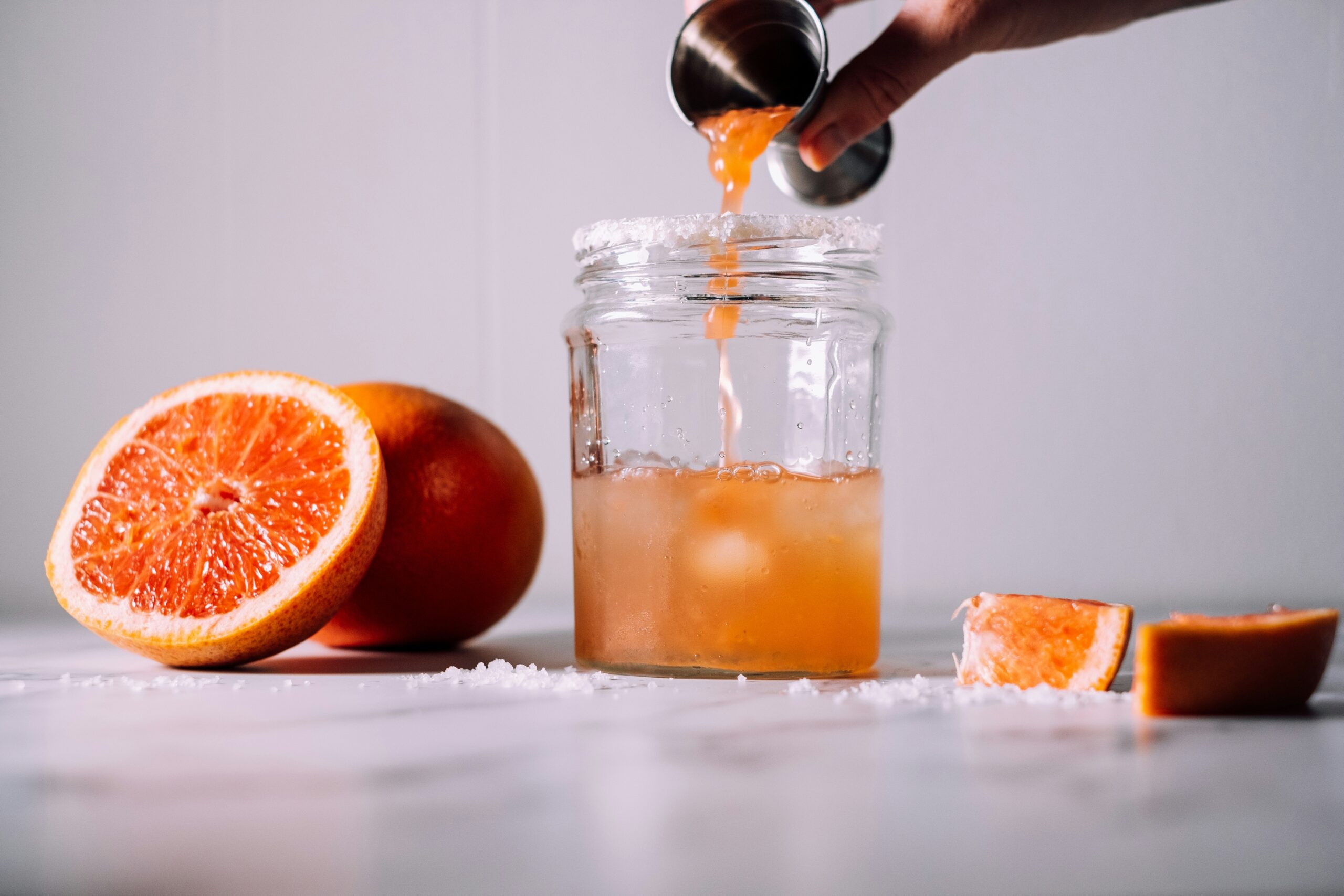 A different take on the regular cocktail, try making a blood orange adrenal cocktail. Pictured: Blood orange being poured into a glass