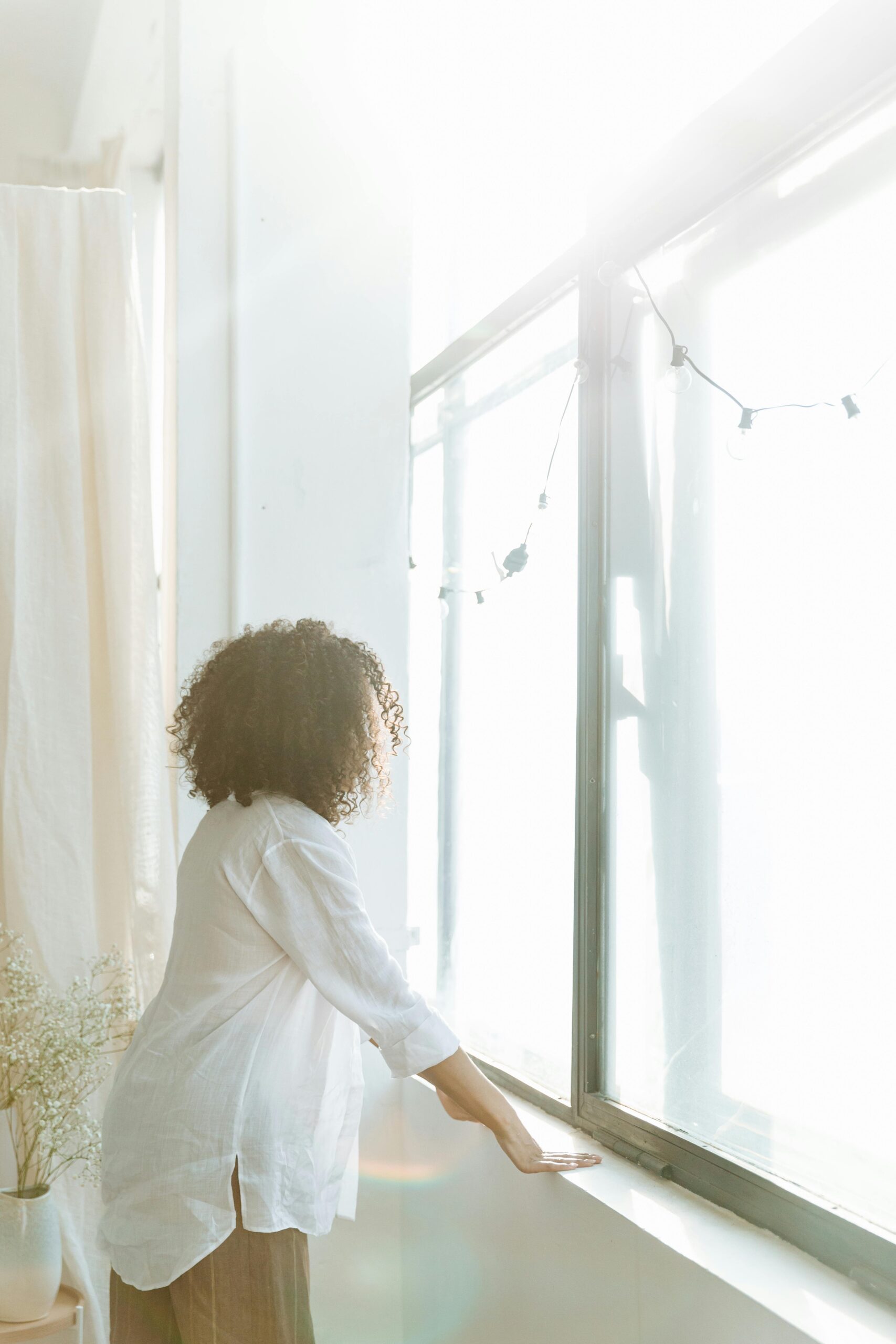 A woman looking out of a window